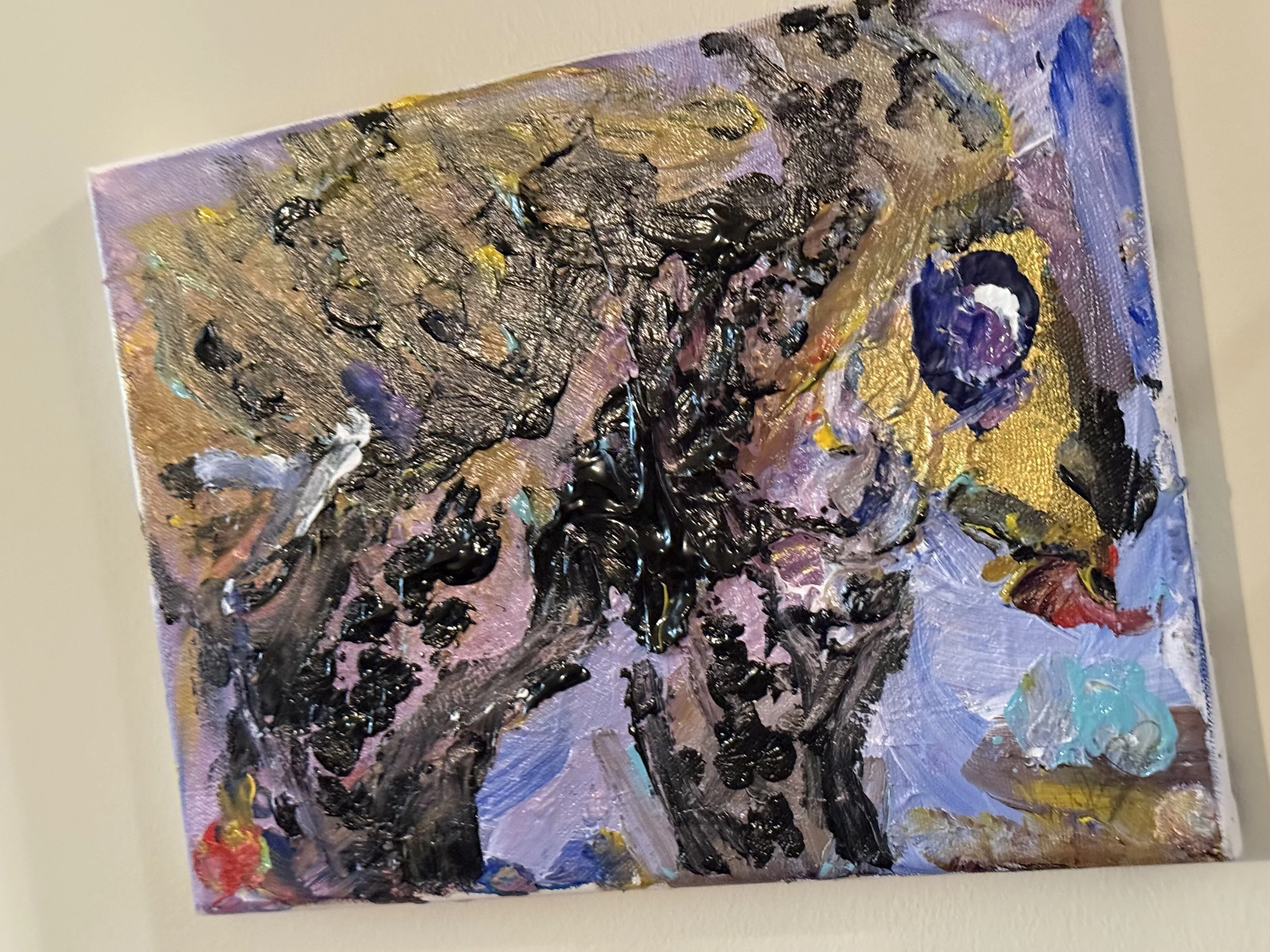 Abstract painting with bold black brushstrokes, purple, blue, gold, and red accents on textured canvas.