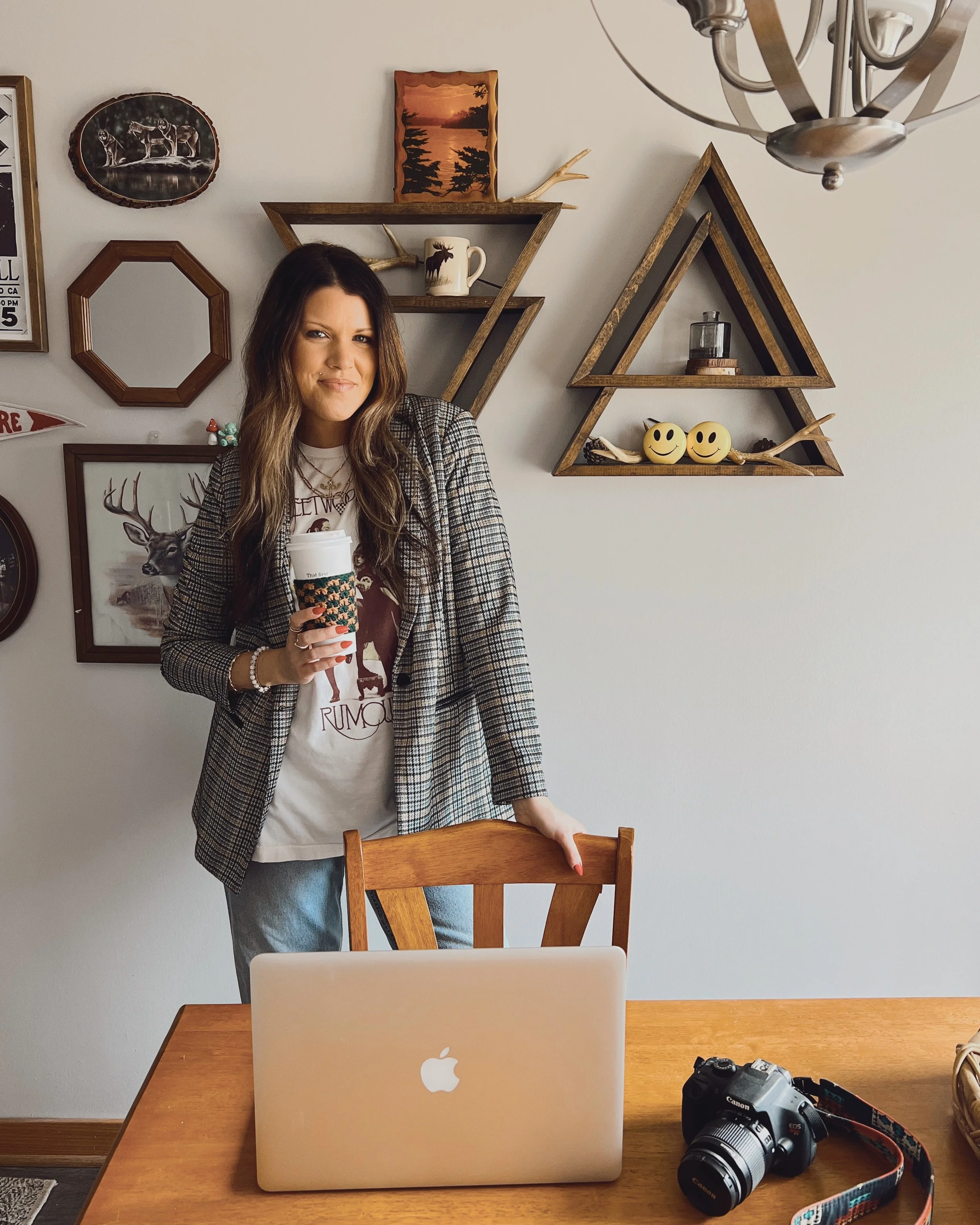 Naomi Goff brand designer lifestyle headshot holding coffee cup in styled room setting