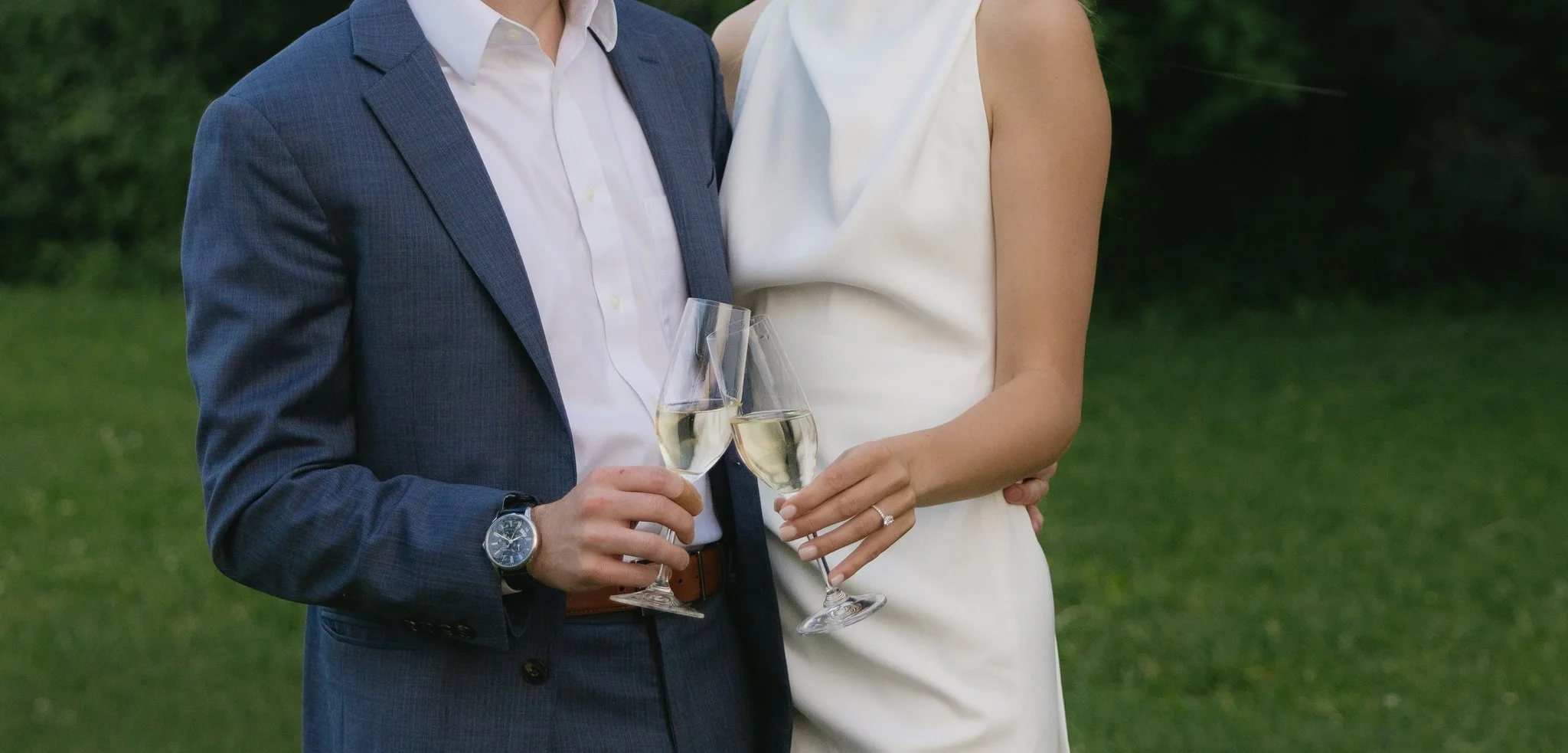 Close up of couple holding champagne during engagement session