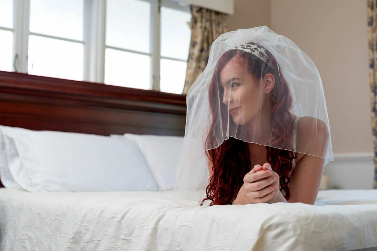 bridal-boudoir-brisbane-veil-bedside-candid.jpg