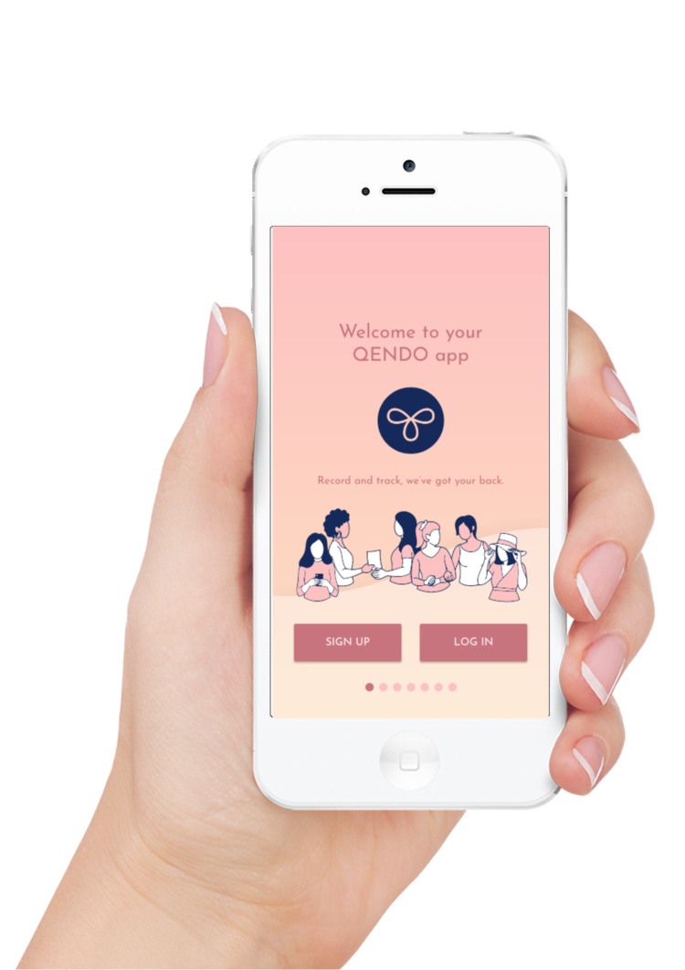 Hand holding a white smartphone displaying the QENDO app's welcome screen with pink background, logo, illustration of women using smartphones, and sign up and log in buttons.