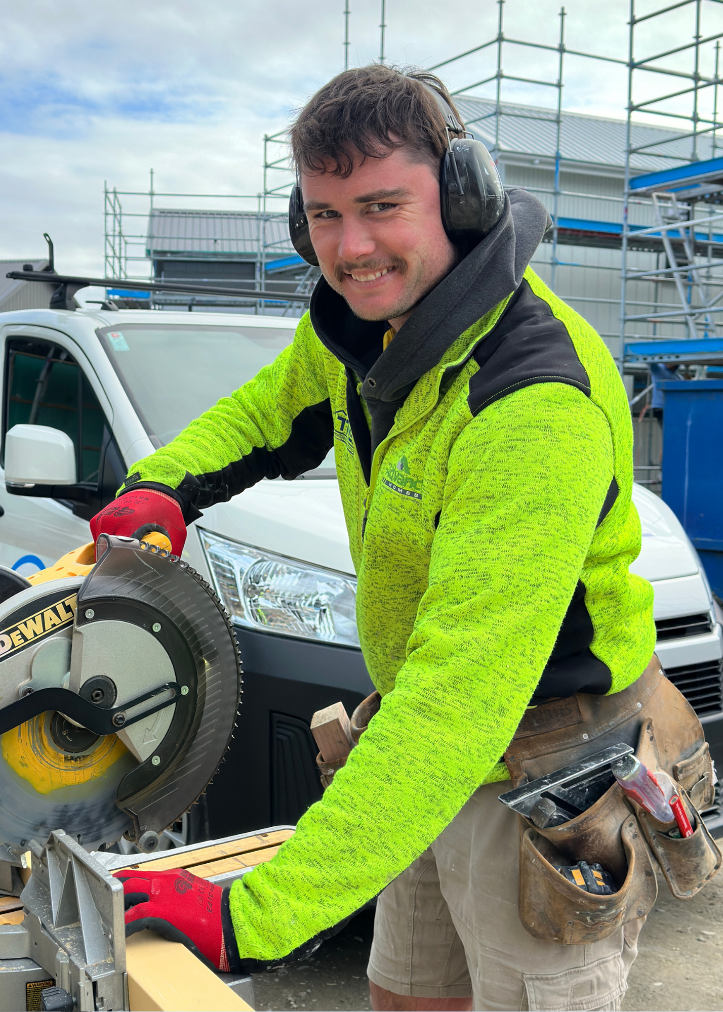 THS team member on skillsaw with earmuffs