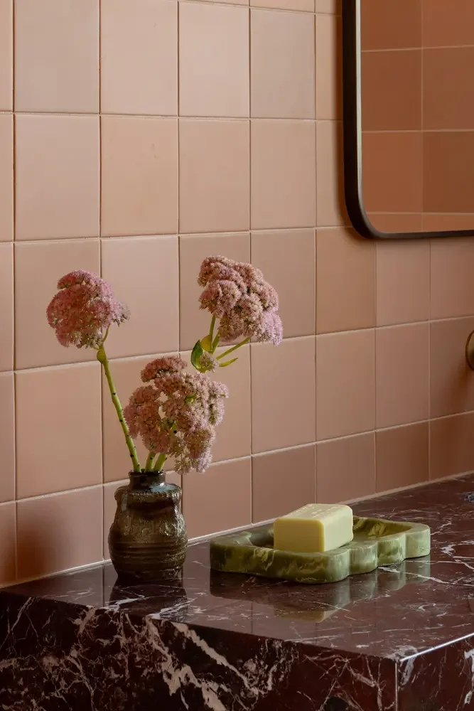 vase with flowers on a marble bench