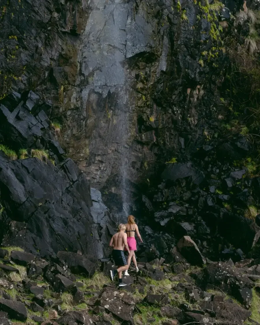 two people walking along an outdoor trail