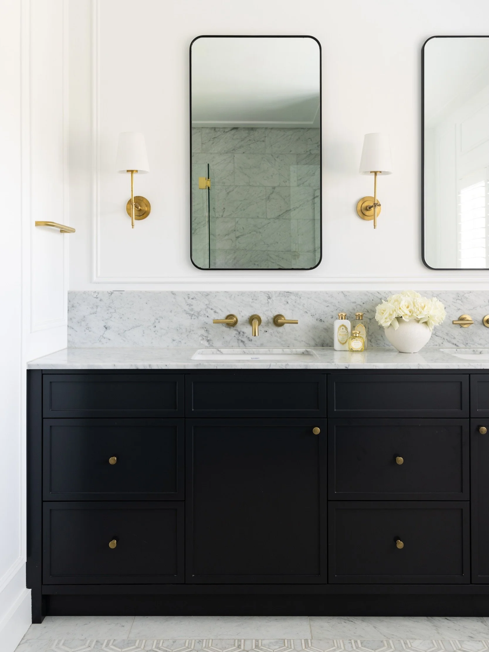 A considered mix of timeless finishes transition from the ensuite bathroom through to the dressing room and primary bedroom at Northwood. Each area connects, creating a refined and cohesive space. Project @strittdesignandconstruction. Styling @style_