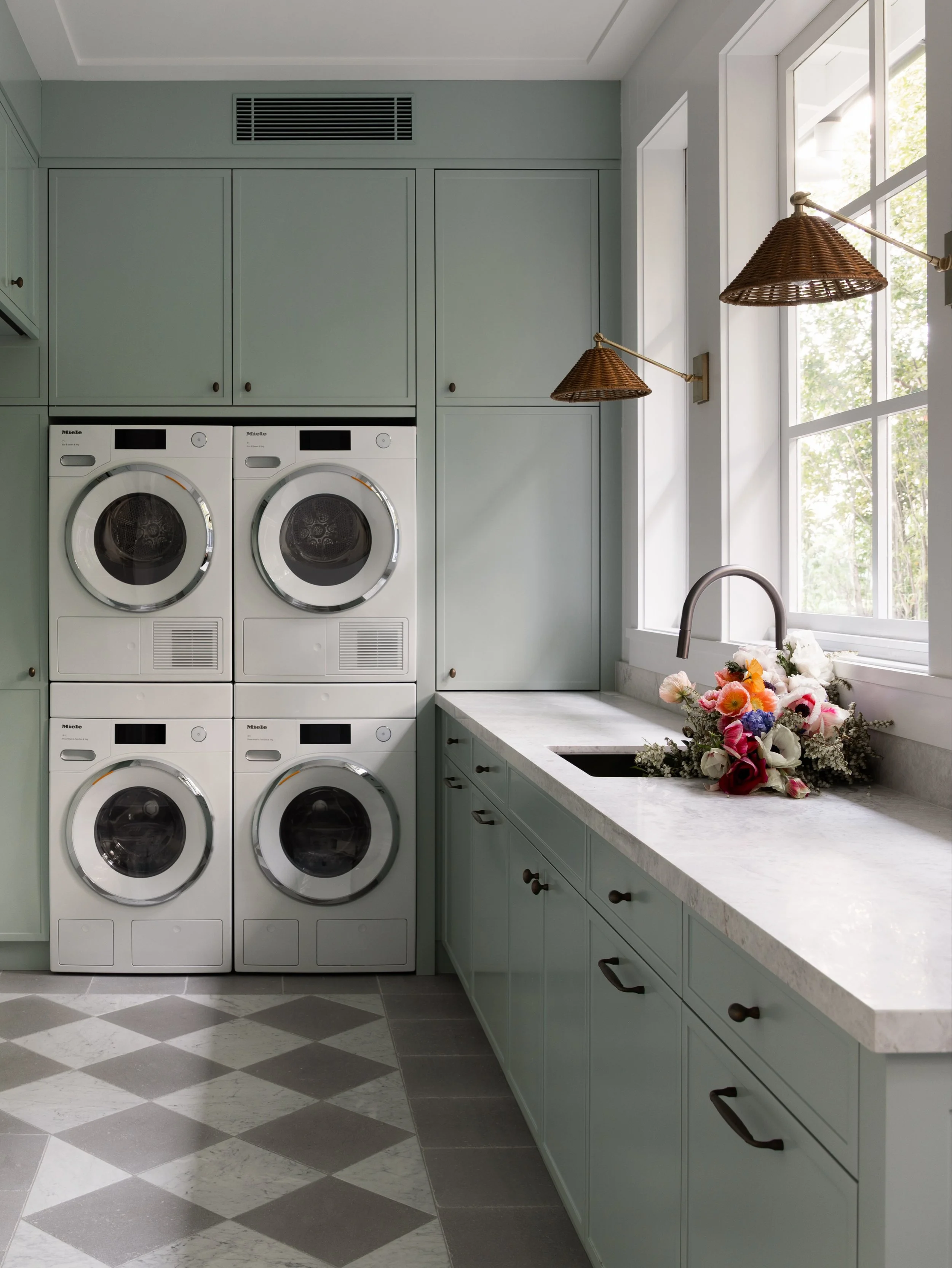 A glimpse inside the light-filled laundry of our recently completed Balmoral Beach House project. Soft green cabinetry, natural stone and classic checkerboard flooring come together to create a space that feels both practical and considered. Finished