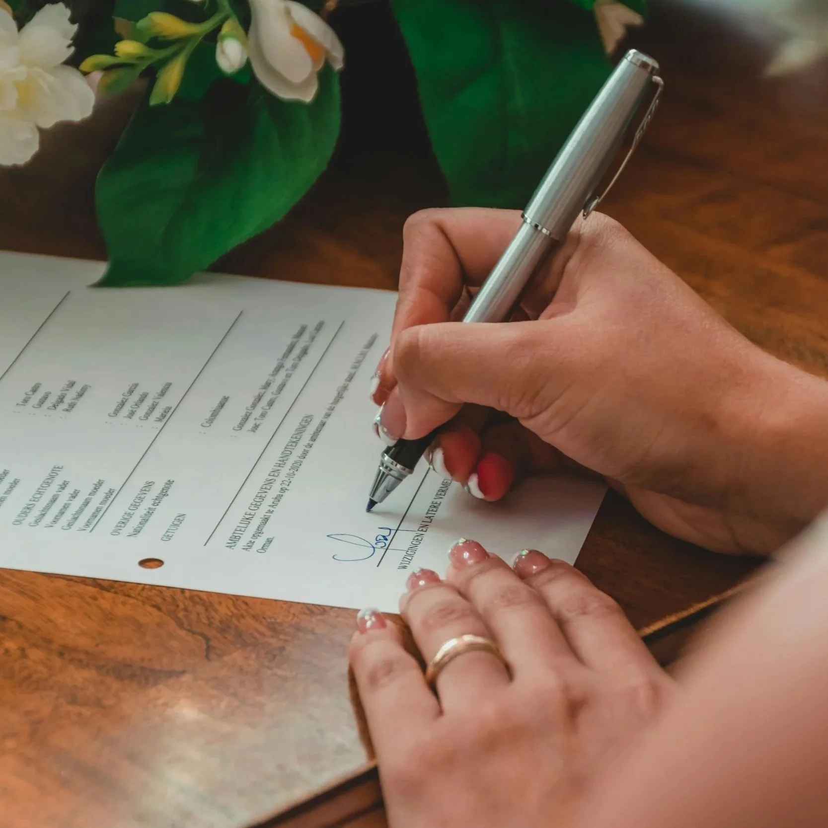 Migration Agent signing documents ready to be sent to the department of home affairs.