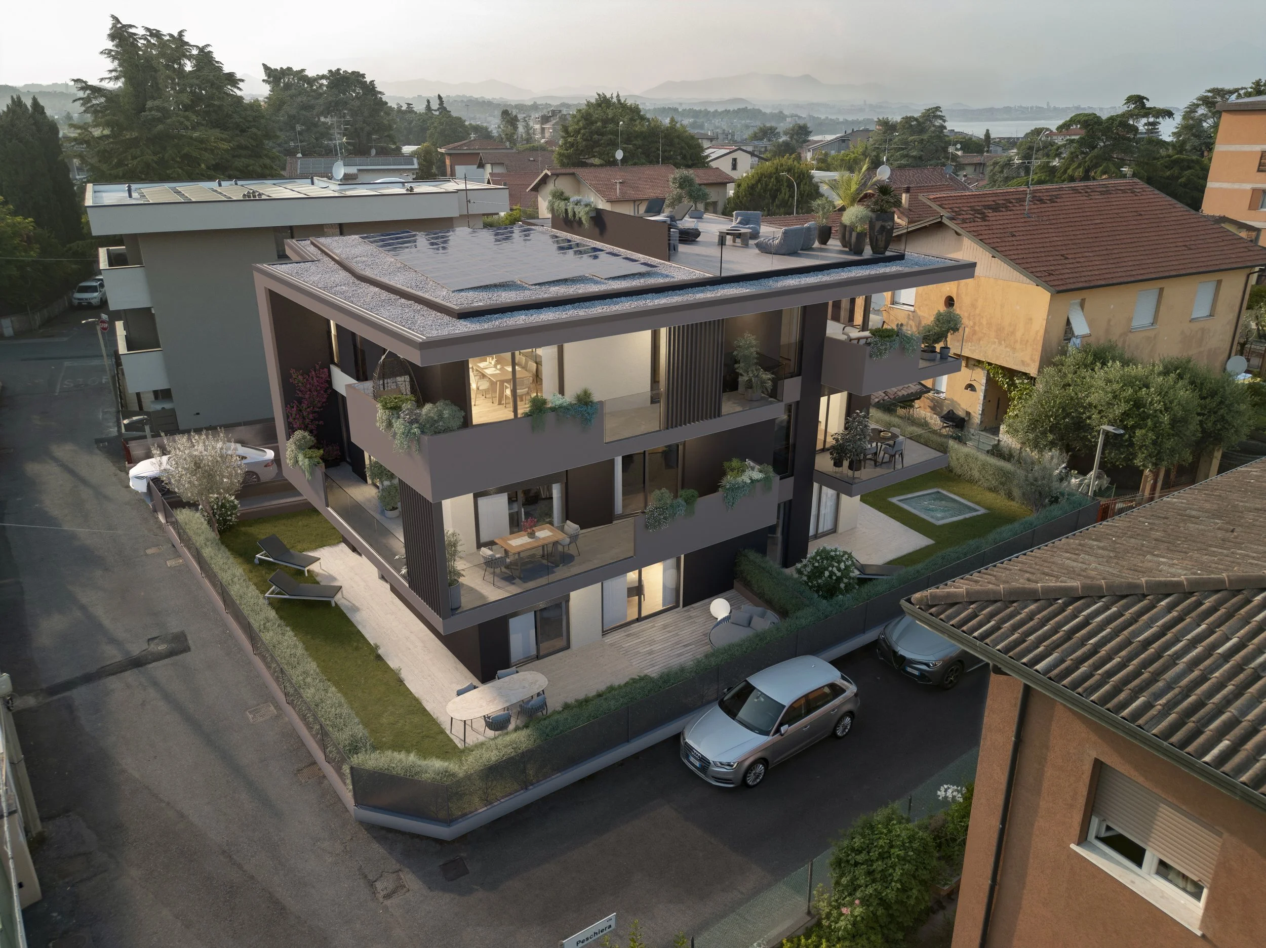 A modern multi-story residential building with balconies, rooftop terrace, swimming pool, and outdoor seating areas in a neighborhood with other houses and trees.