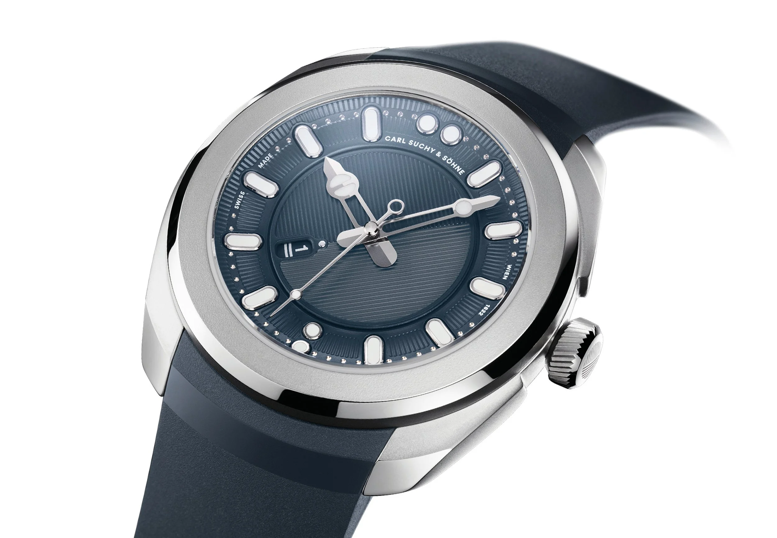 Close-up of a luxury wristwatch with a dark blue dial, silver case, and black strap.