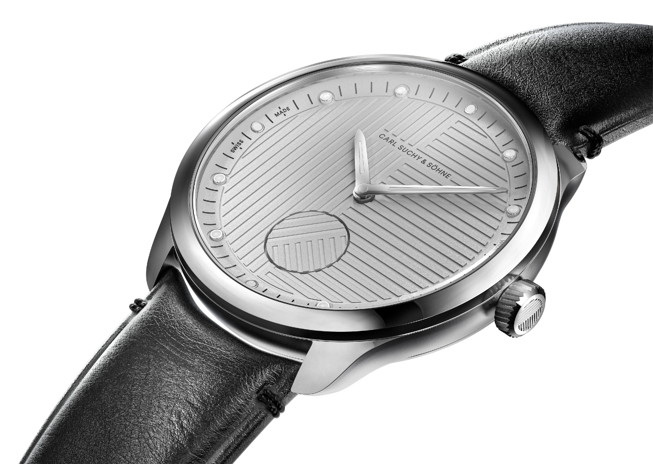 Close-up of a silver wristwatch with a black leather strap, featuring a textured dial, white hour markers, and the brand name 'Carl Suchy & Söhne' on the face.