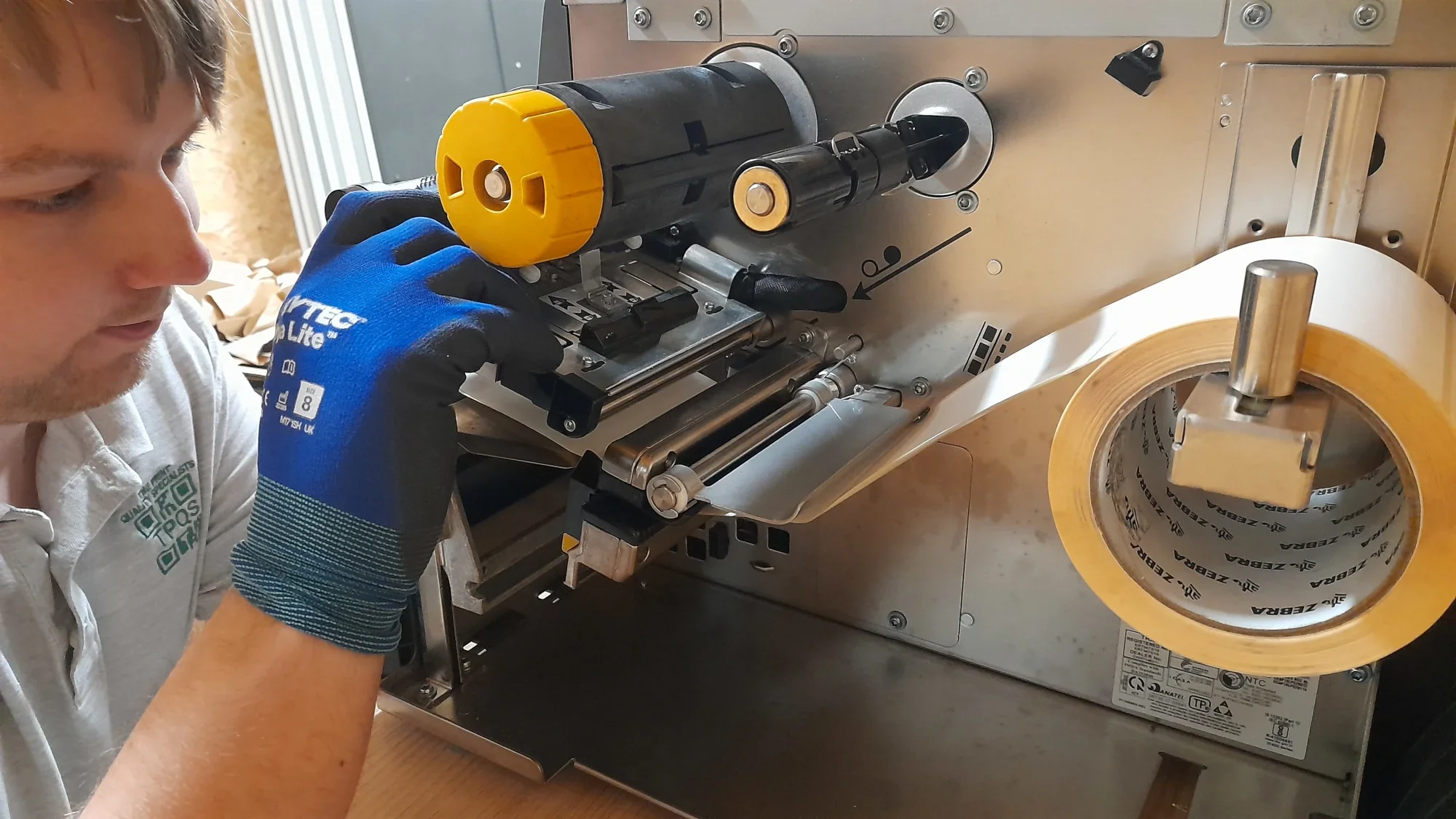 Engineer performing label printer repair UK service on thermal barcode printer