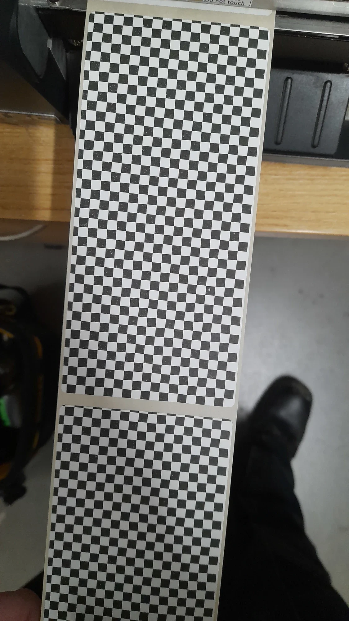 Engineer completing a test print following a thermal printer service