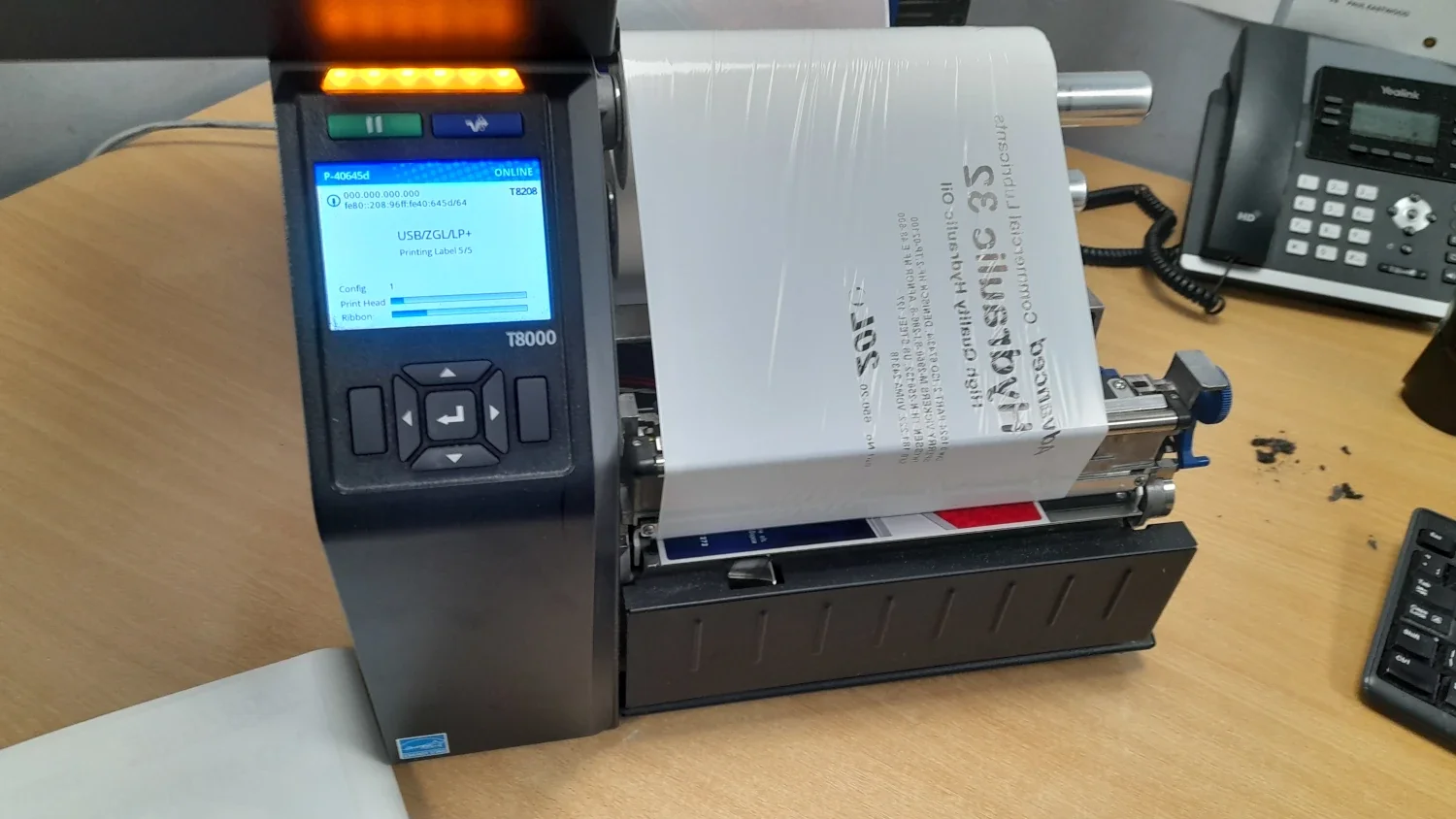 Manufacturing label printer printing barcode labels for products