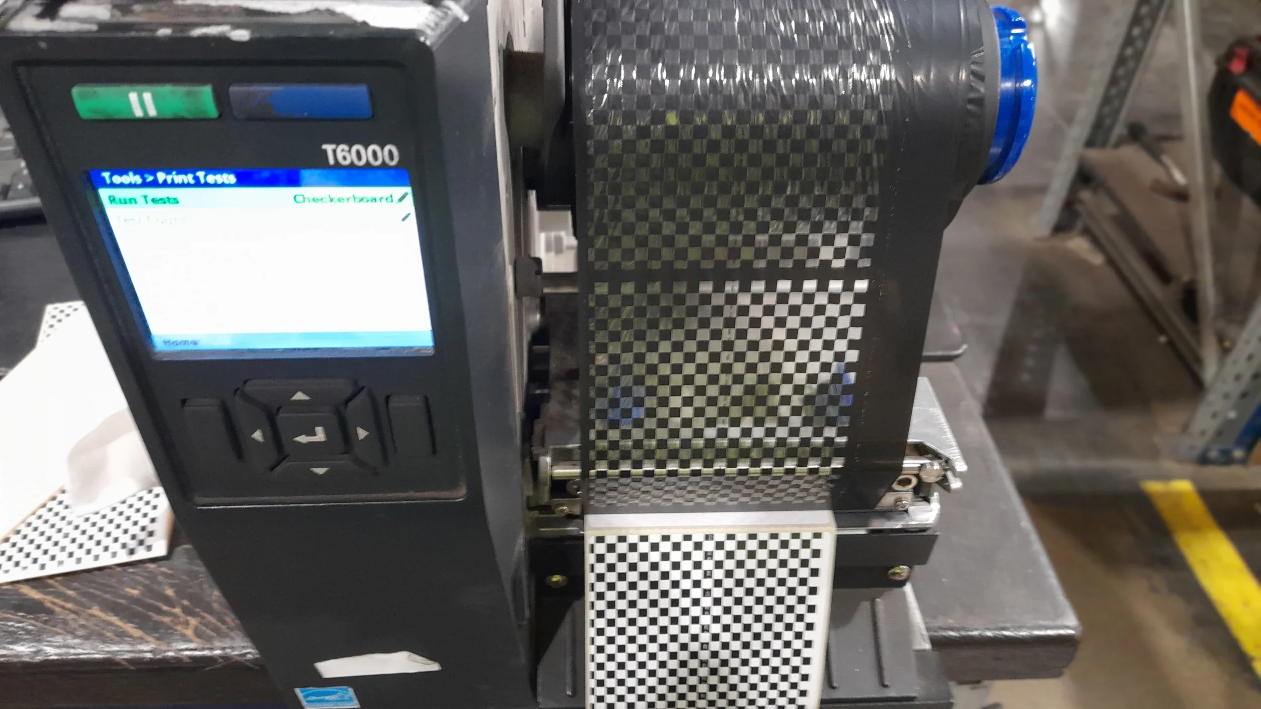 Industrial label printer used in a warehouse for barcode and shipping label printing
