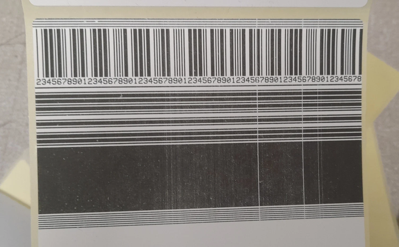 Faulty Zebra ZT411 printhead with white lines running through the print