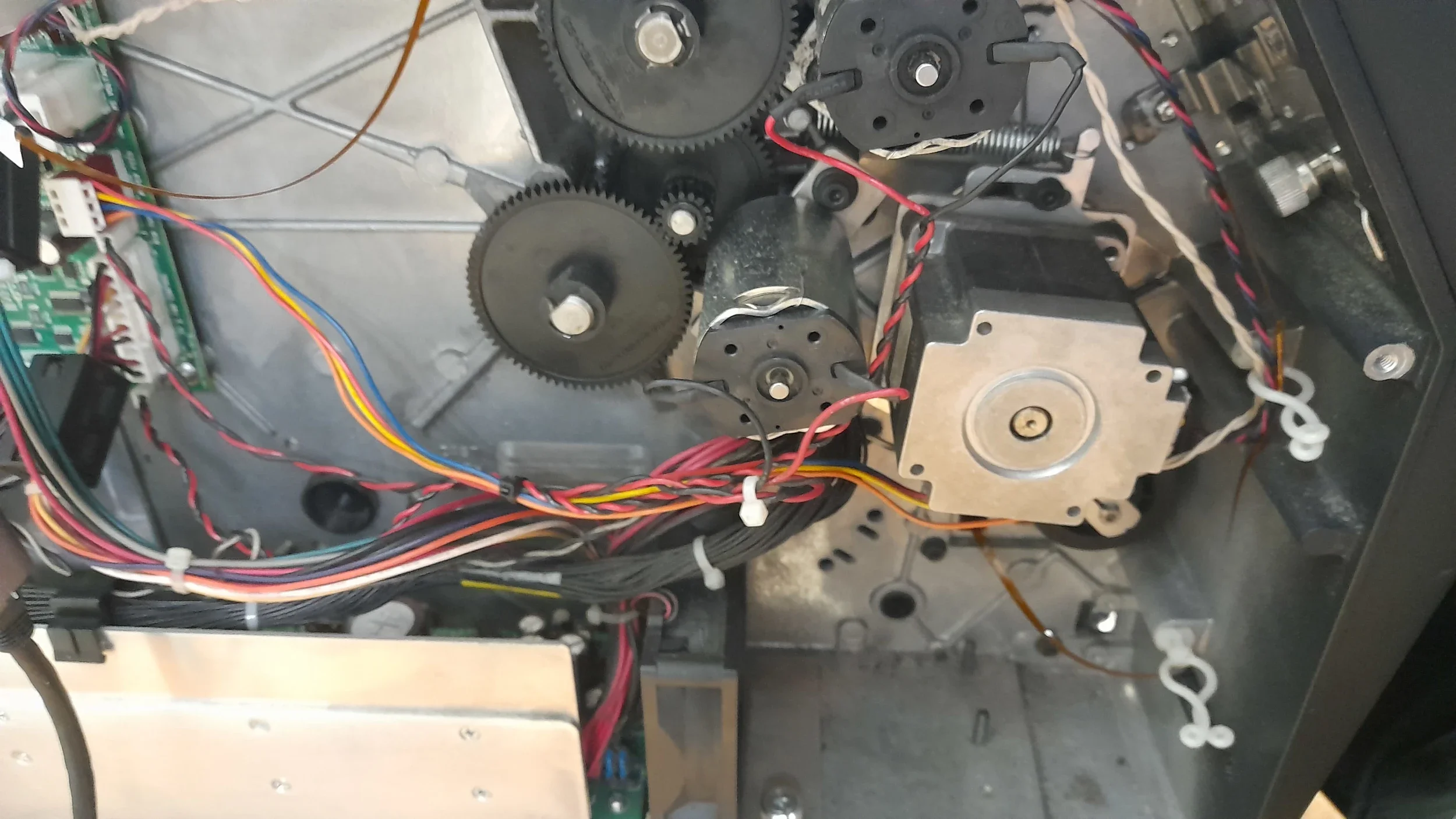 Engineer inspecting drive system  as part of a a TSC T8000 label printer maintenance