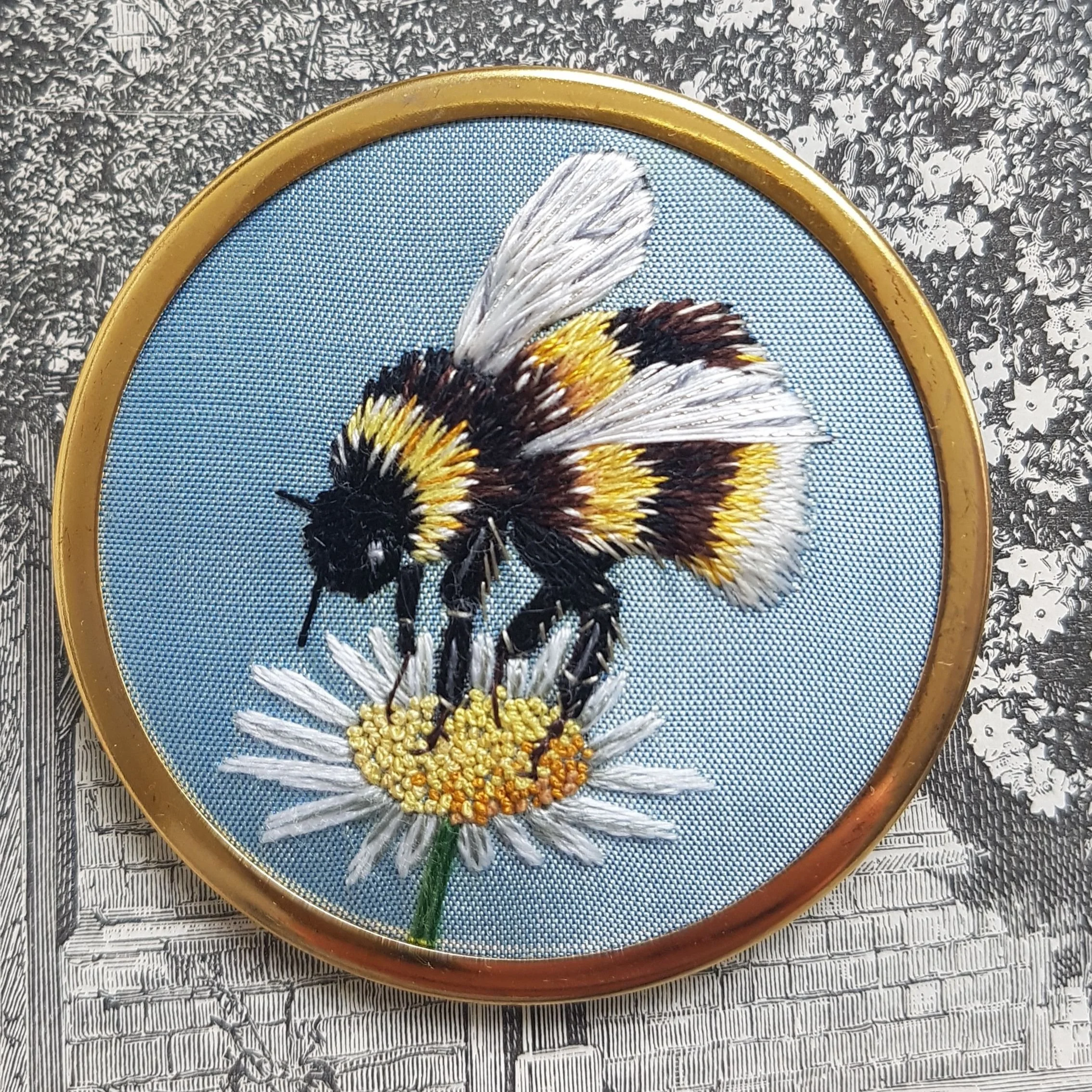 Bee Embroidery Brooch.
A special birthday commission. Long and short stitch in stranded cottons with silver metal thread in the wings.