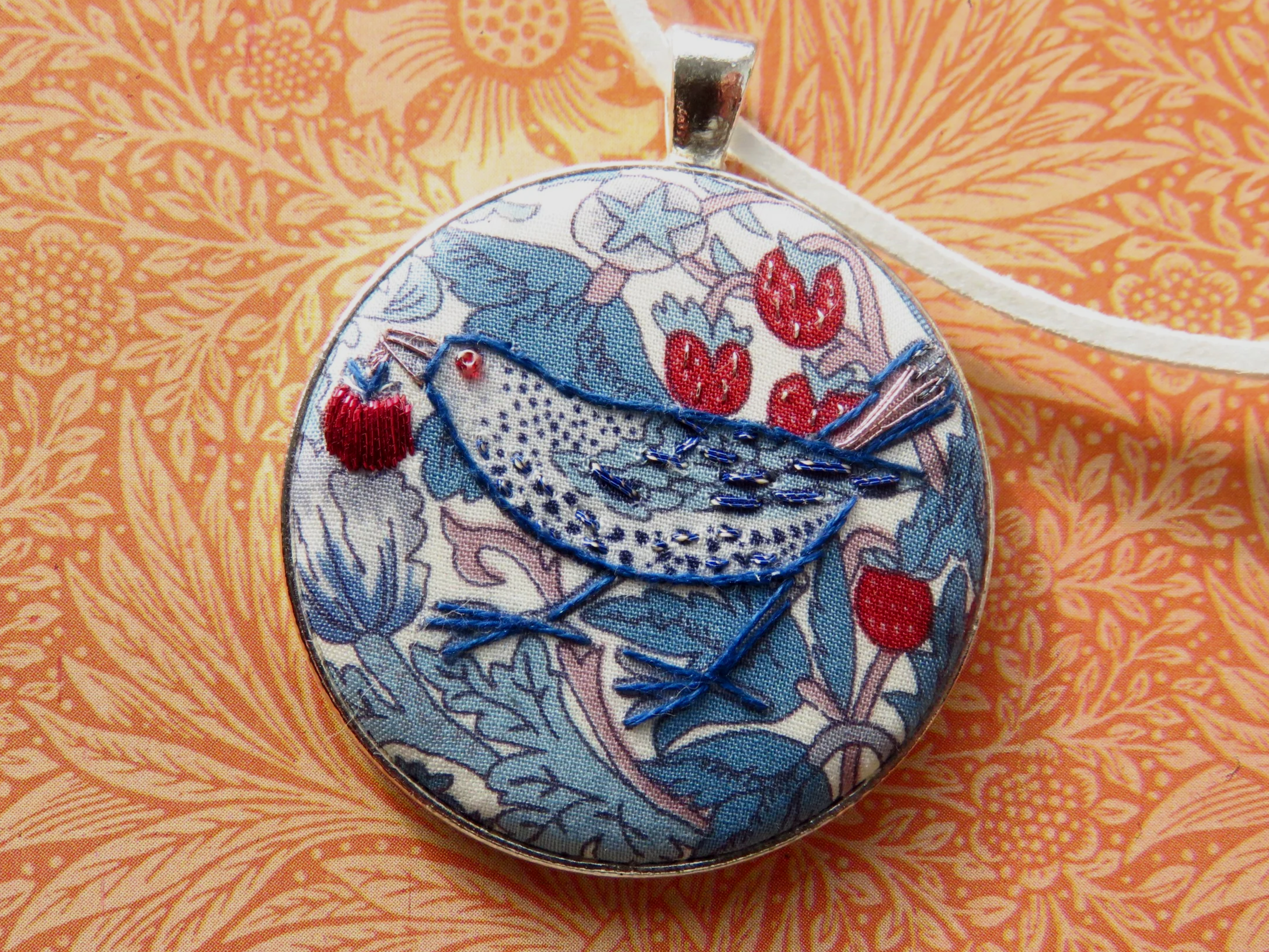 These William Morris Strawberry Thief pendants have been one of my best selling ranges. Liberty of London tana lawn has been embroidered with metallic thread, stranded cotton and tiny beads. Click the pic to purchase. 