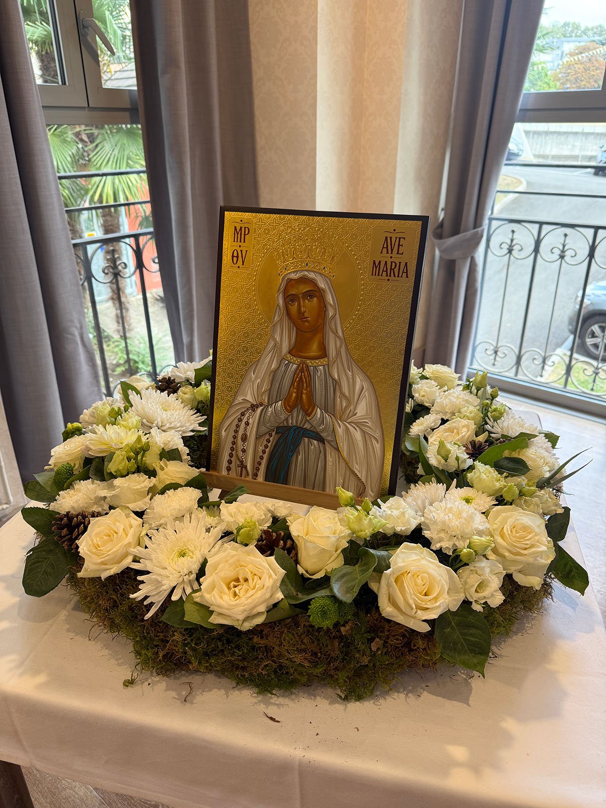 Mary icon surrounded by flowers.jpg