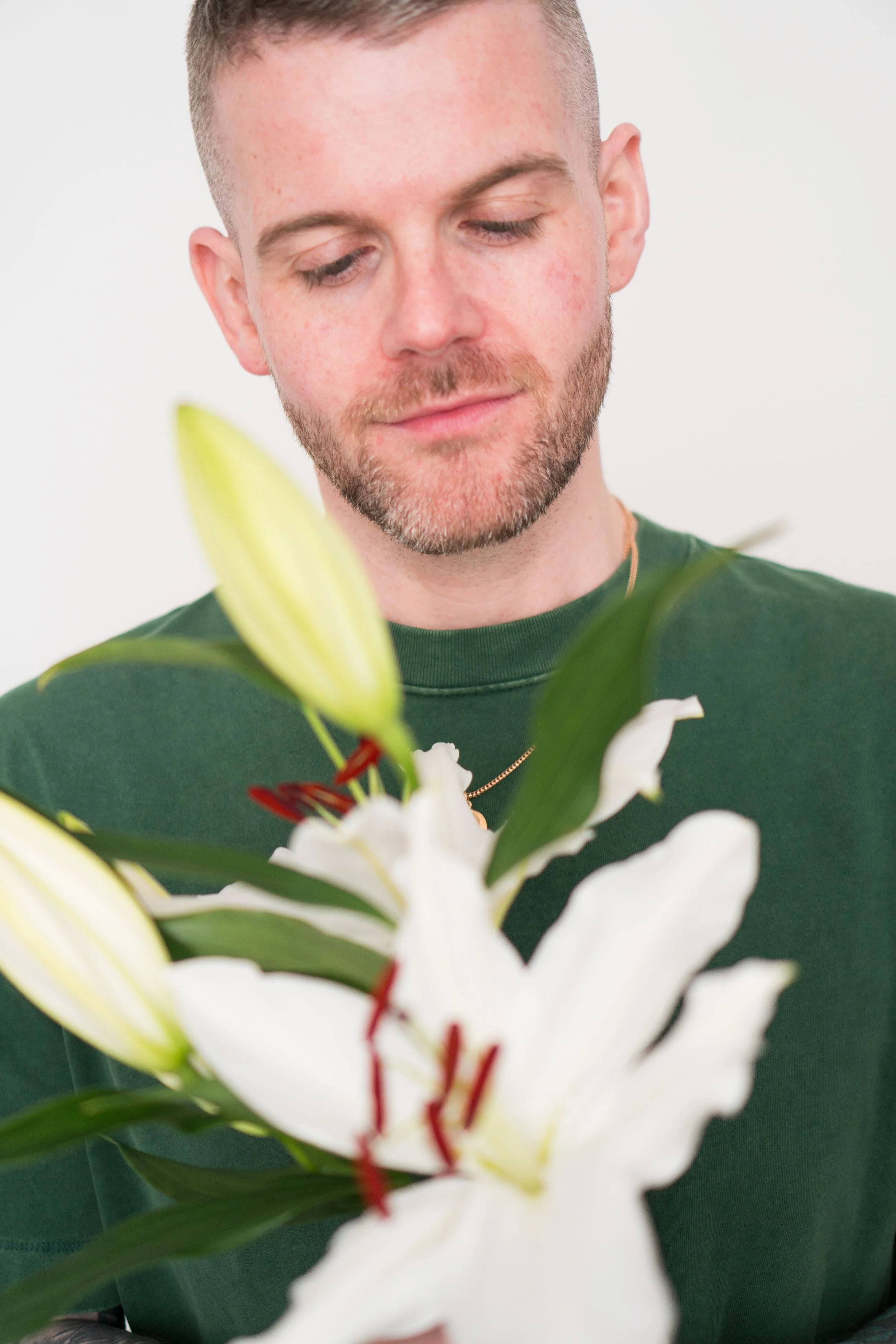 Photo of Kyle Gray holding Lilies