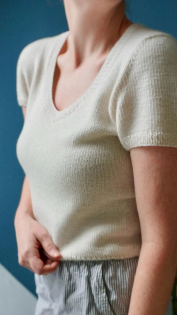 Woman wearing the Cashmere Outside Tee from Arly Knits