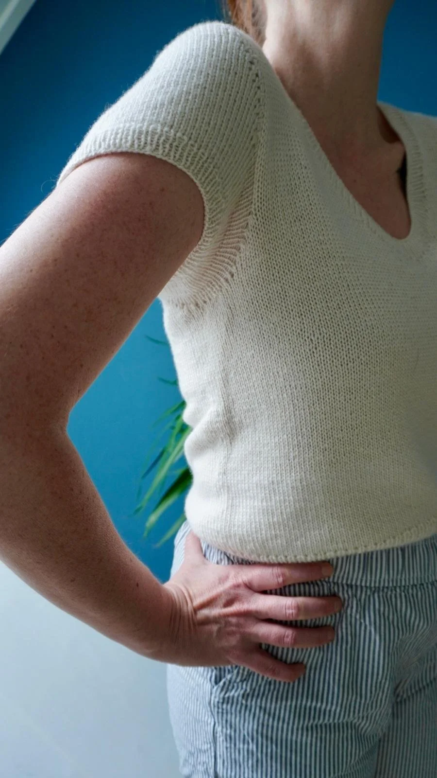 Woman wearing the Cashmere Outside tee in a relaxed setting