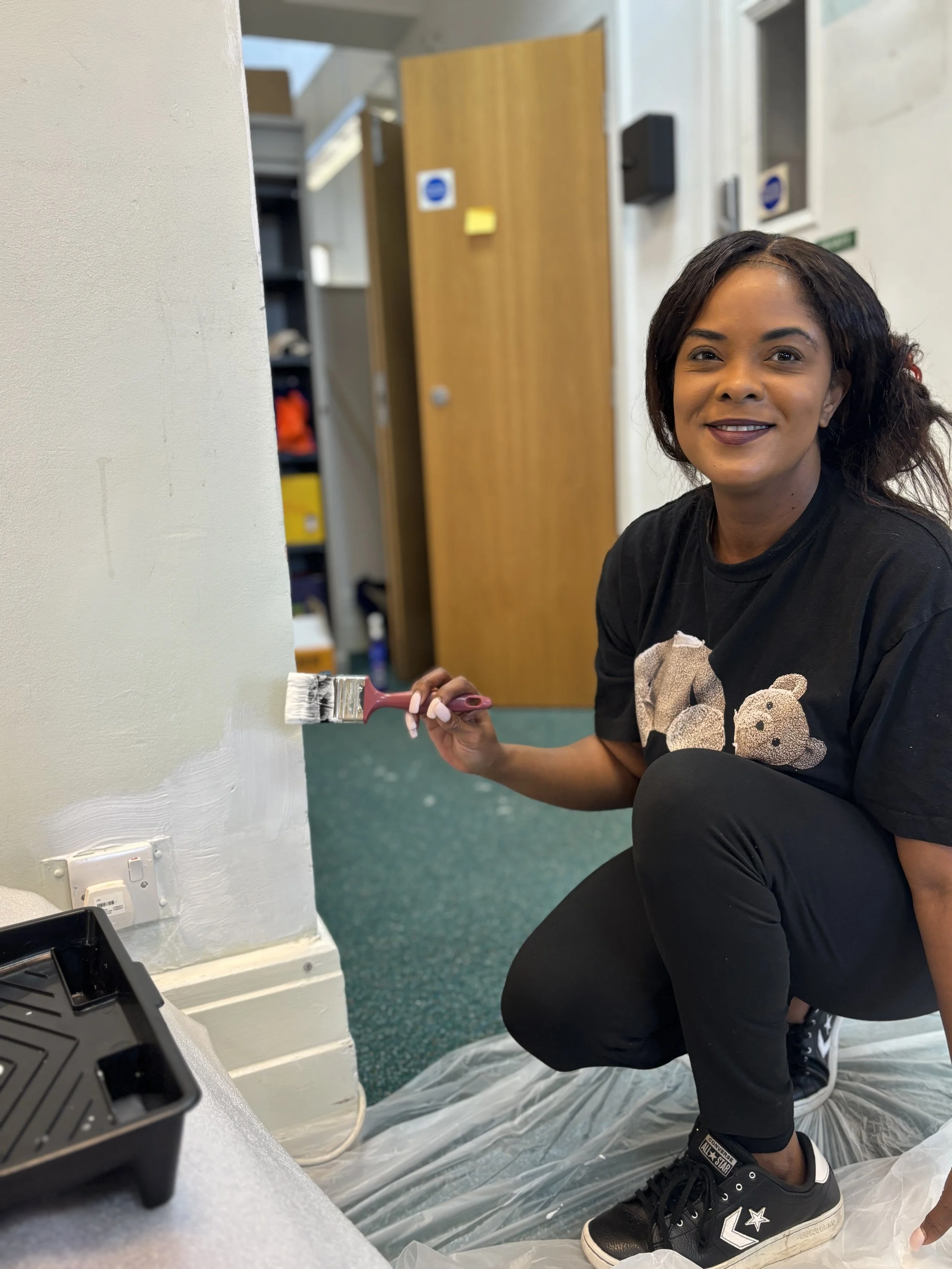 smiling woman with paint brush