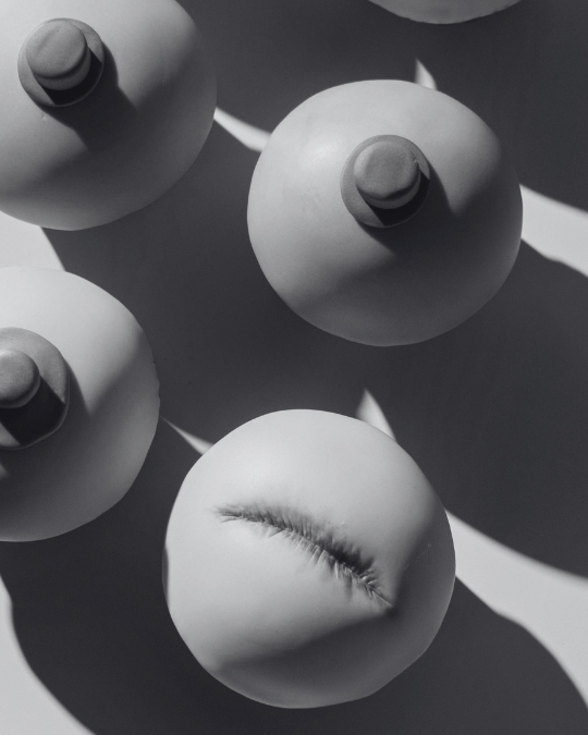 close up of breasts and nipples made out of clay