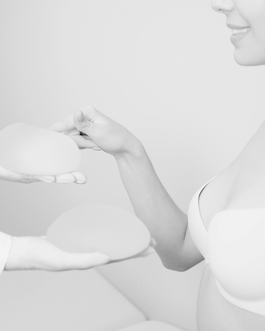 Woman Looking at the implant options for her breast augmentation