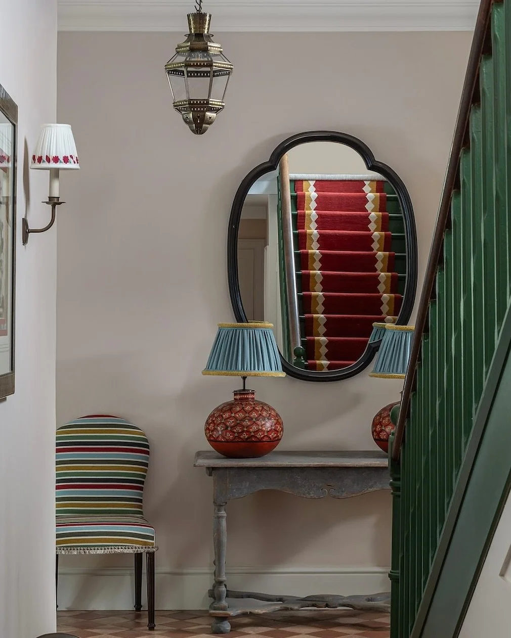 A hallway with lots of colour.  We used a bespoke runner from @sophiecooneyrunners which you can see reflected in the mirror.  The lamp bases are from @kateguinnessdesign which were perfect for this space ❤️