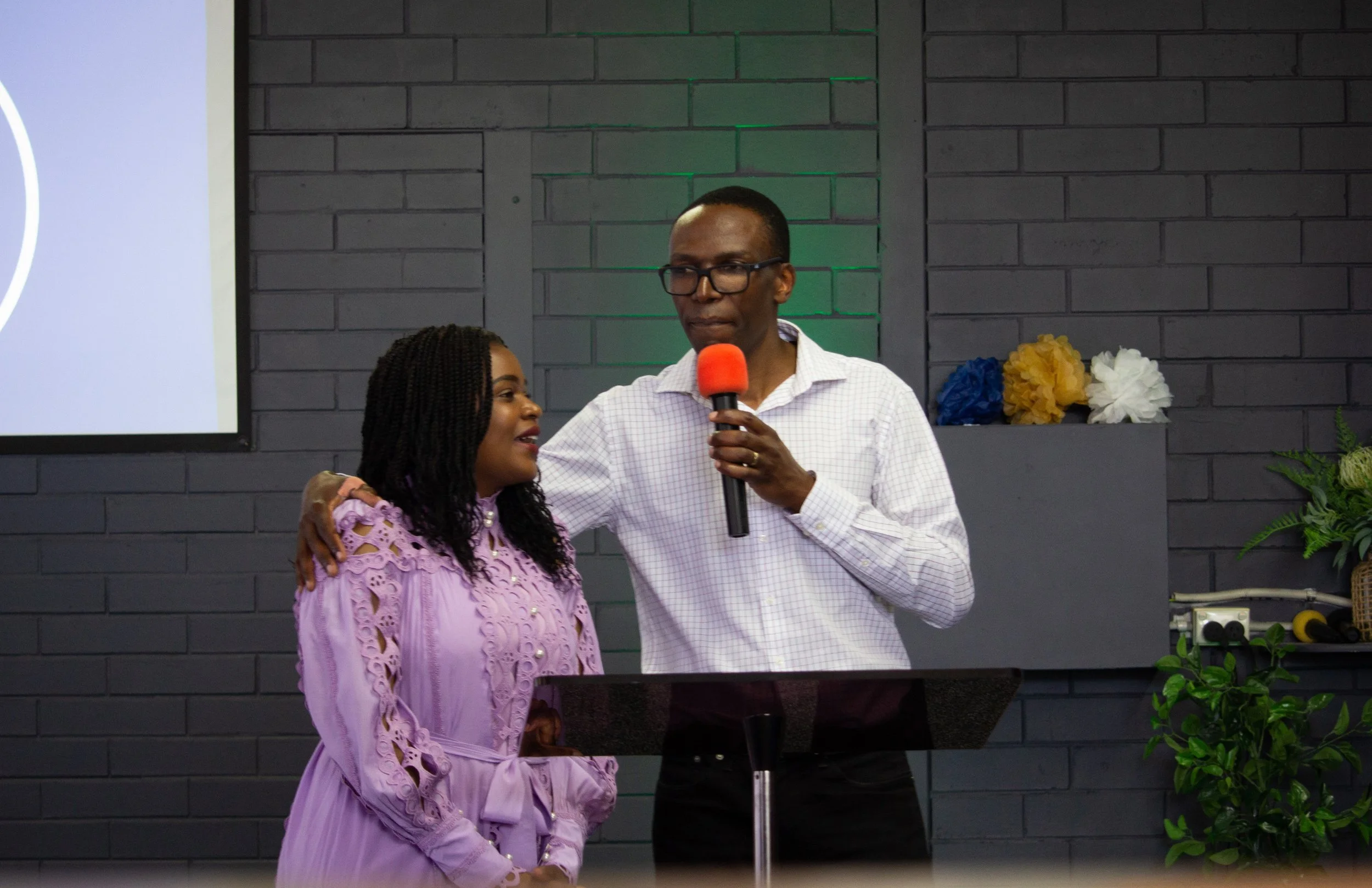 Pastors Simon Phiri and Yemu Phiri, pictured at the front of a Greaterlife Church Sunday Service
