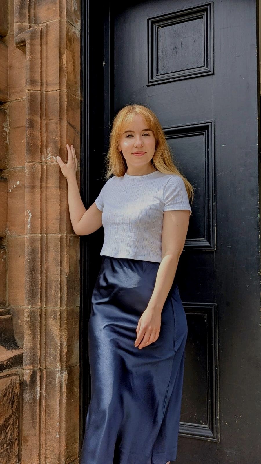 Nutritionist in front of door