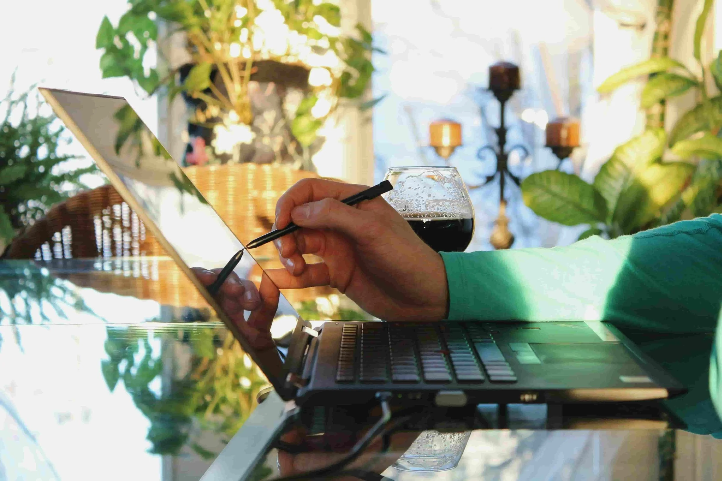 woman hand pointing at laptop