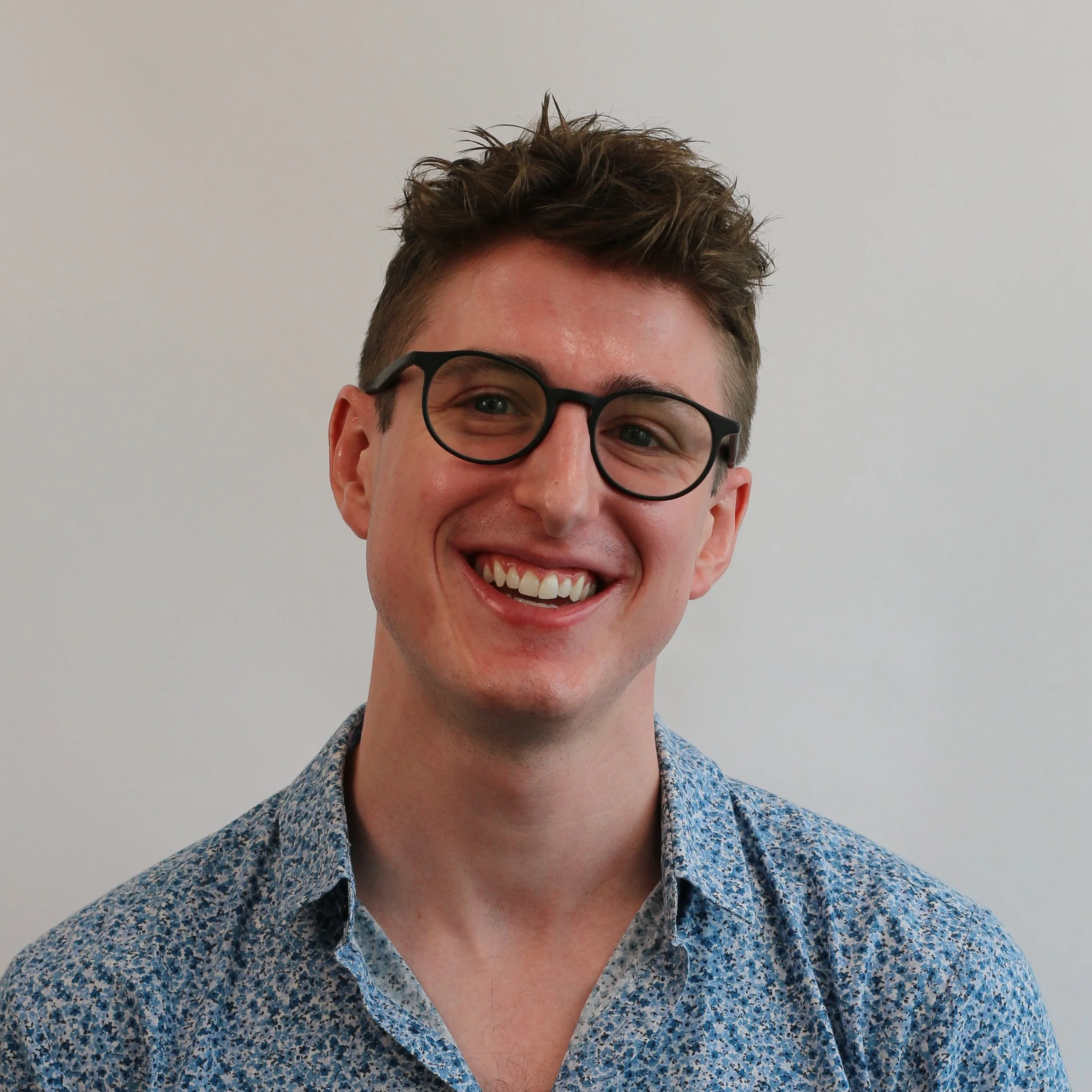 Professional headshot of Austin Seeley, Philadelphia interior designer and founder of Austin Seeley Interiors, specializing in timeless and sustainable residential interior design.