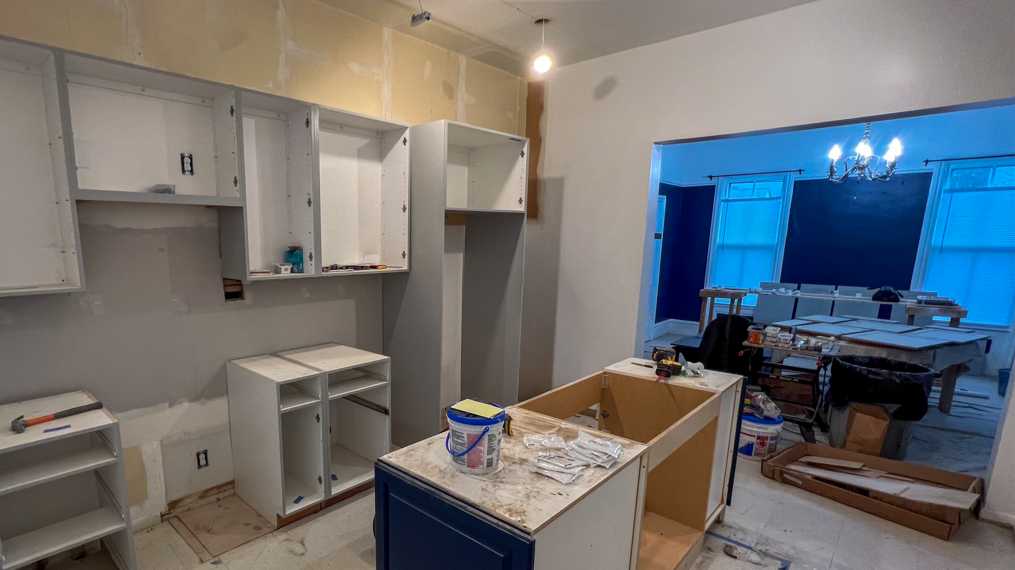 When should you hire an interior designer during a renovation?