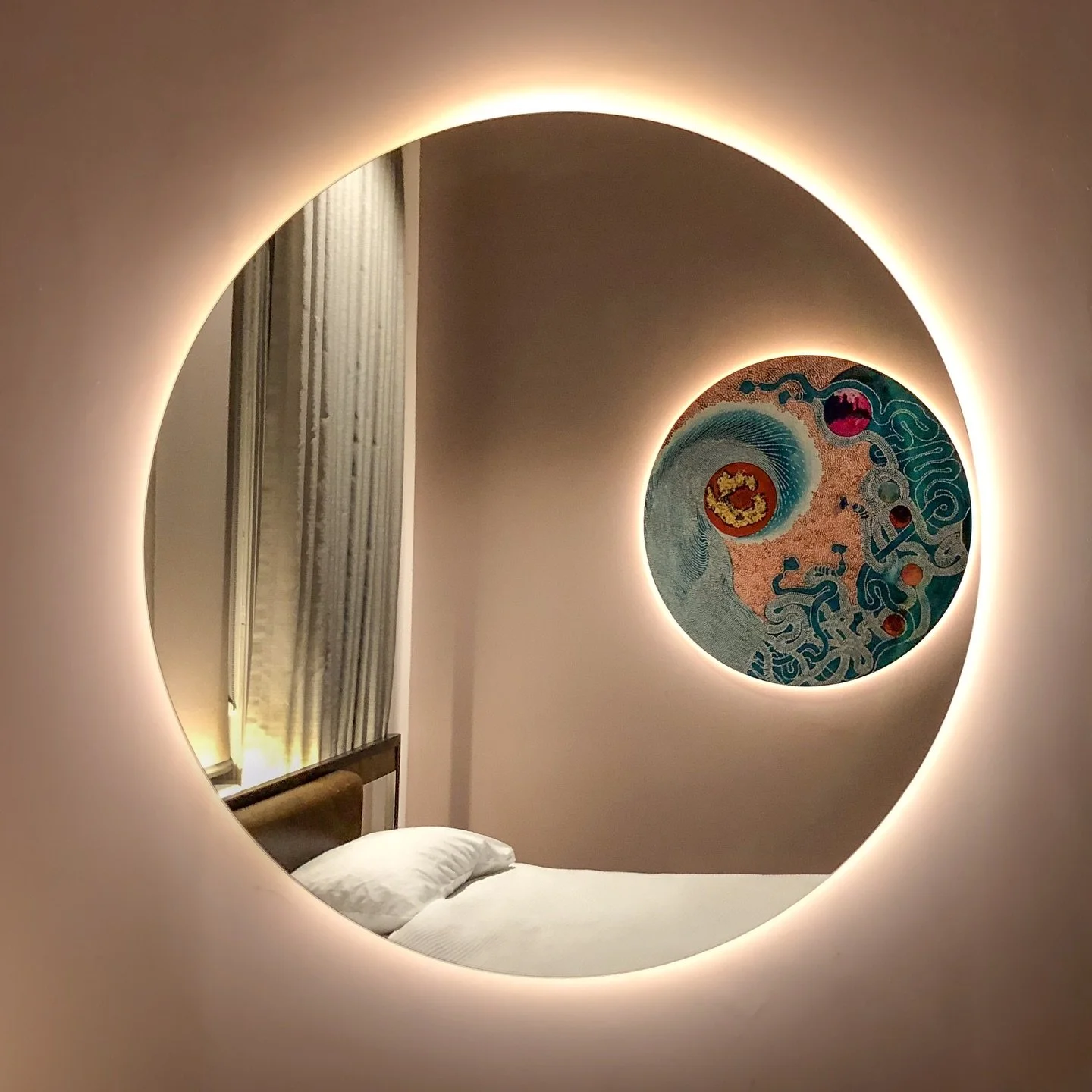 Travel Inspiration ✨ Saw this beautiful piece of art (close up in second picture) at the Clarence Boutique Hotel in Tauranga, New Zealand. Particularly loved how it was lit from behind as was the circular mirror that reflected it directly across the 