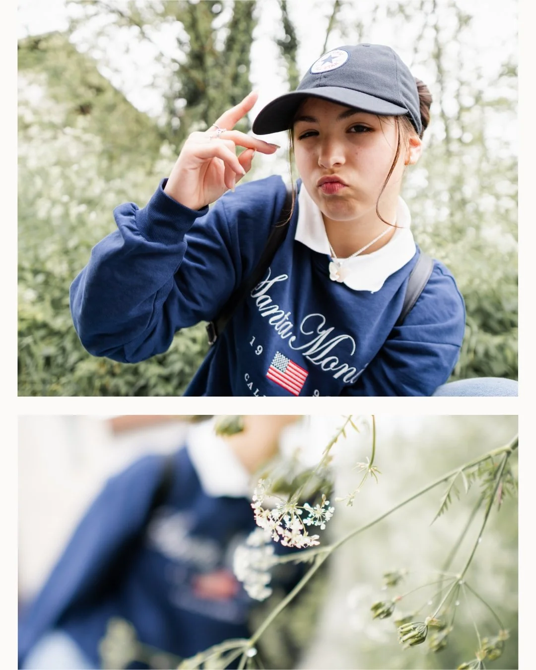 A young woman outdoors in a forested area, wearing a blue sweatshirt with the text "Hunting Men" and an American flag. She is adjusting a gray baseball cap with a Converse logo and making a playful facial expression. The second part of the image shows a blurred person in the background amidst white flowering plants.