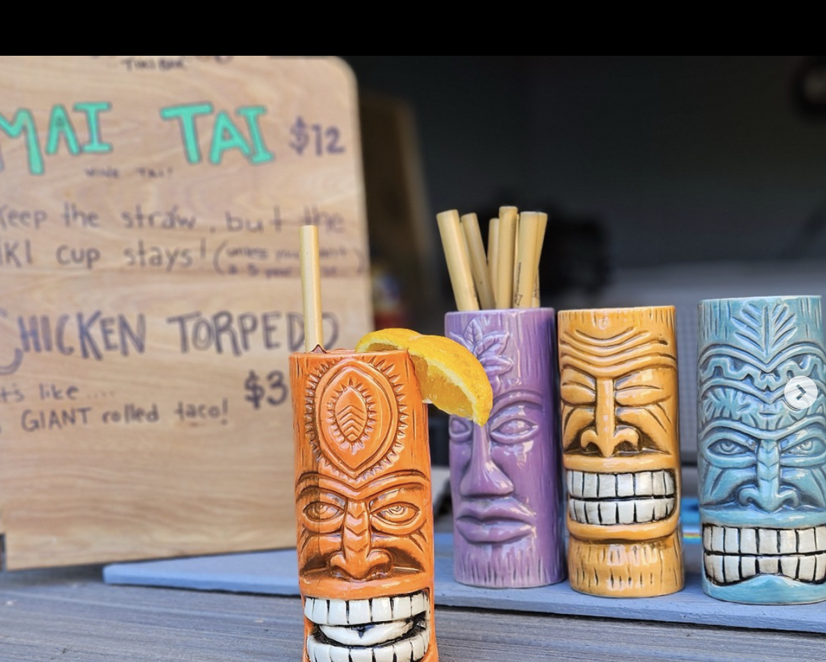 A Tiki Bar with 4 fun Mai Tai mugs.