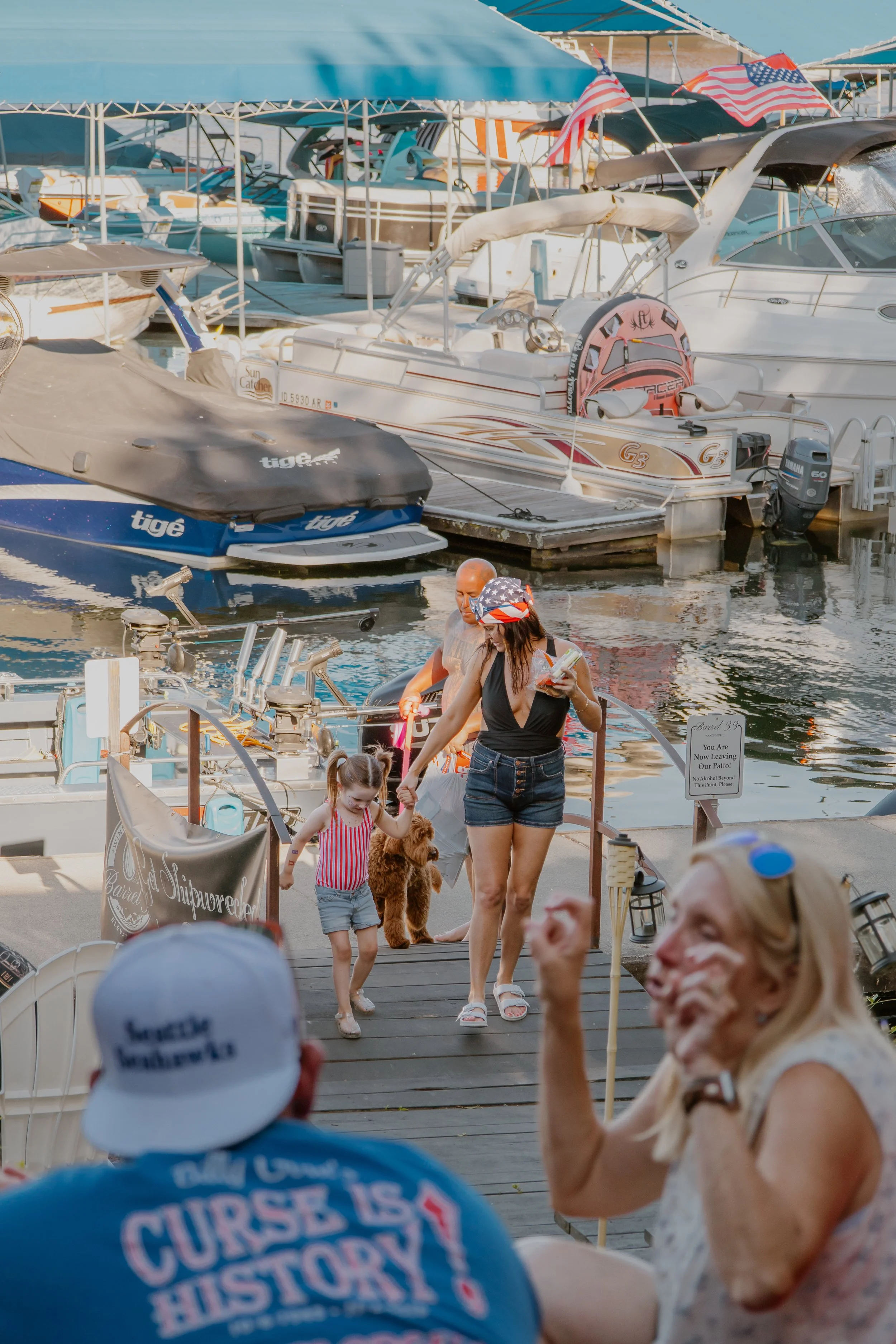 Family walking onto the back patio from the boardwalk