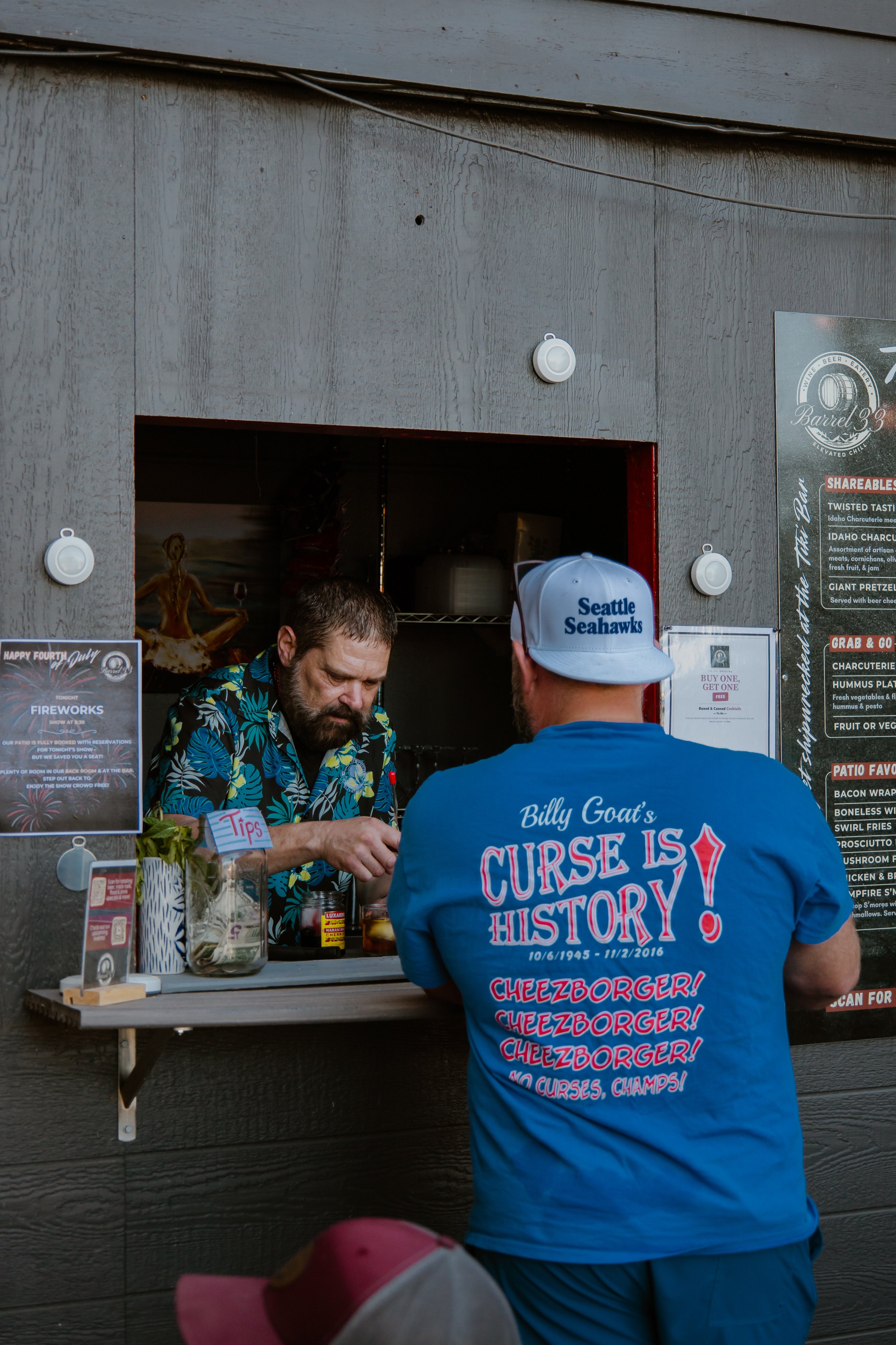 Guy ordering at the Tiki Bar from bartender