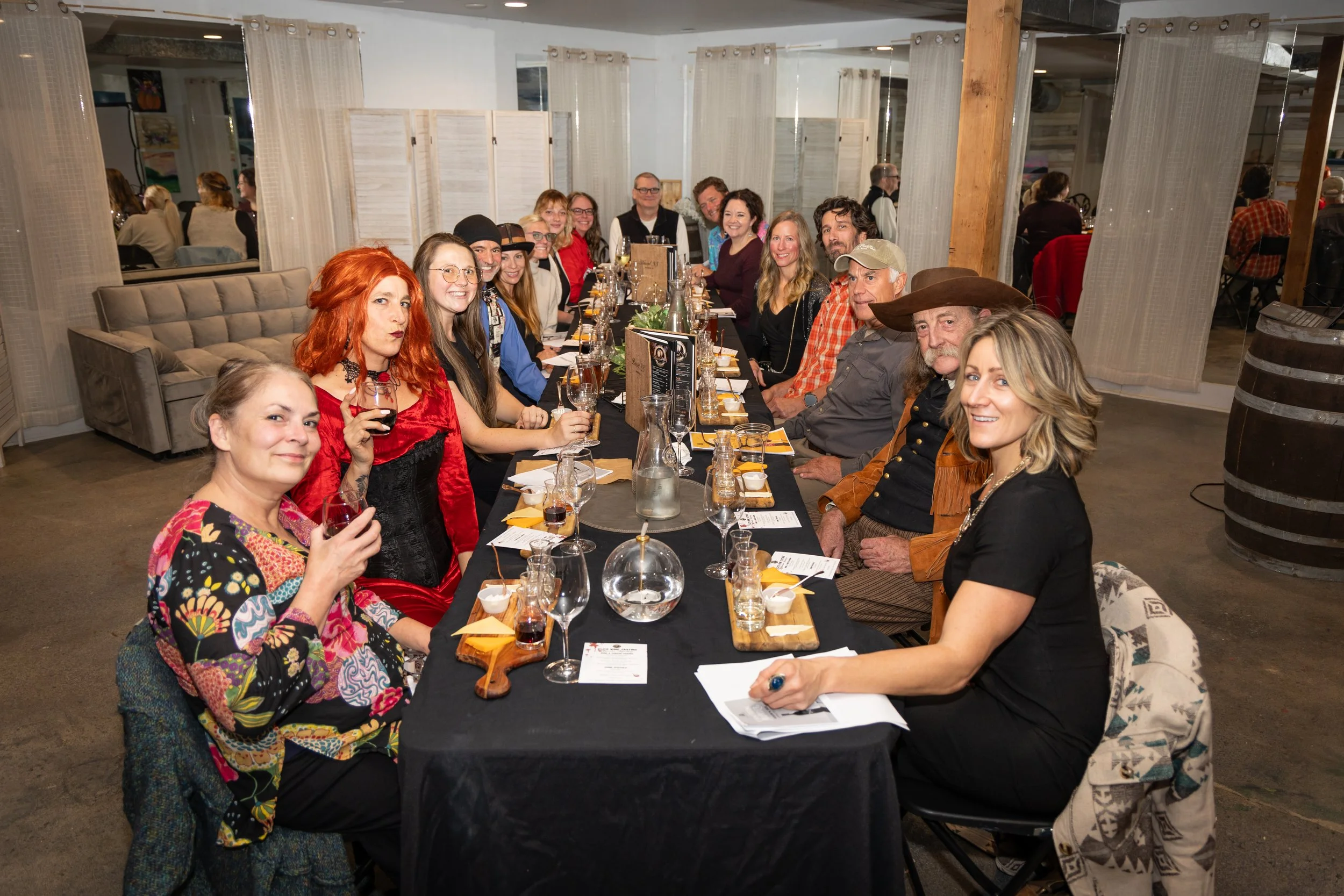 Full table of people smiling at our Murder Mystery Event