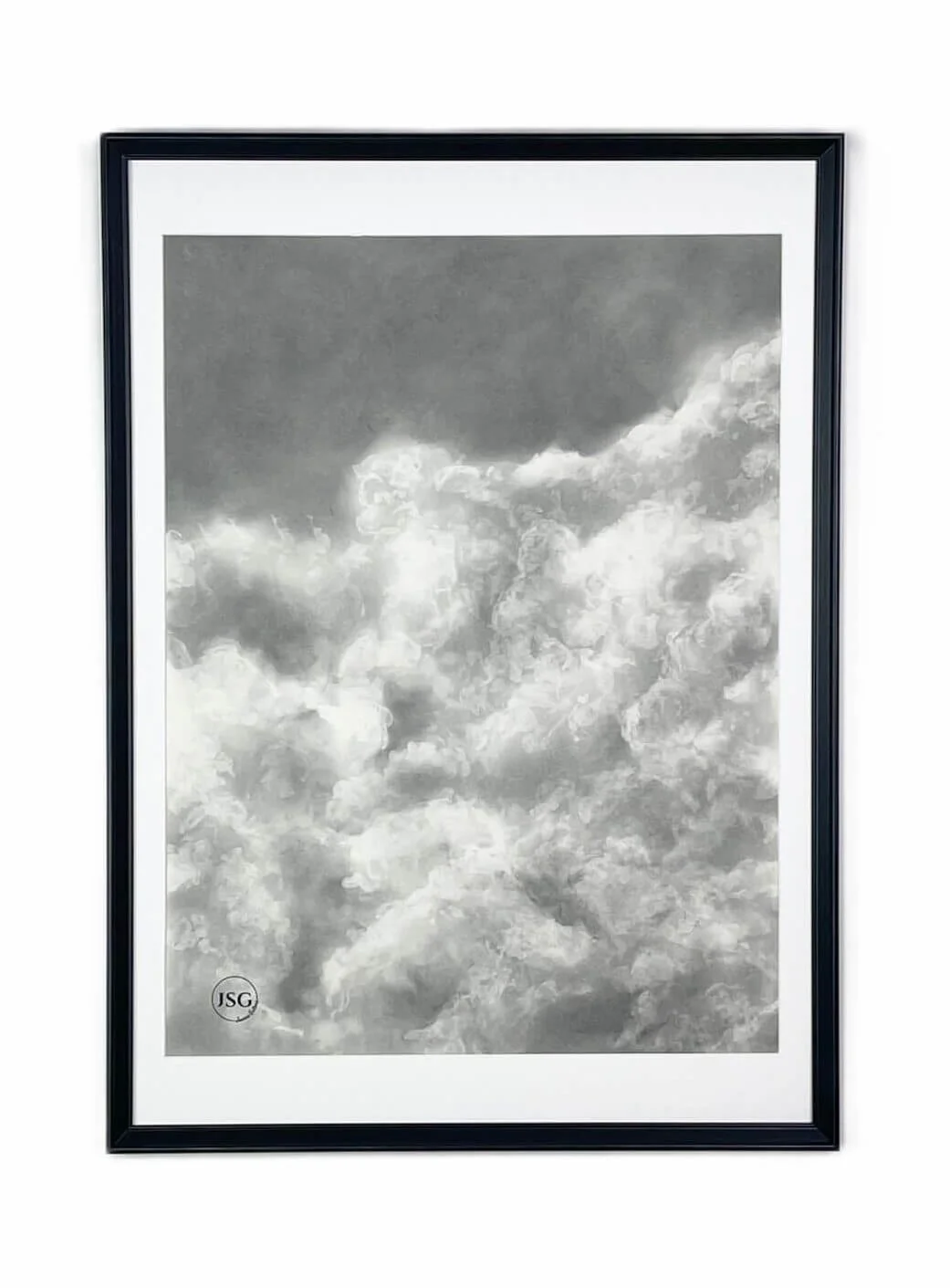 A framed black-and-white photograph of cloudy sky with dark and light clouds.