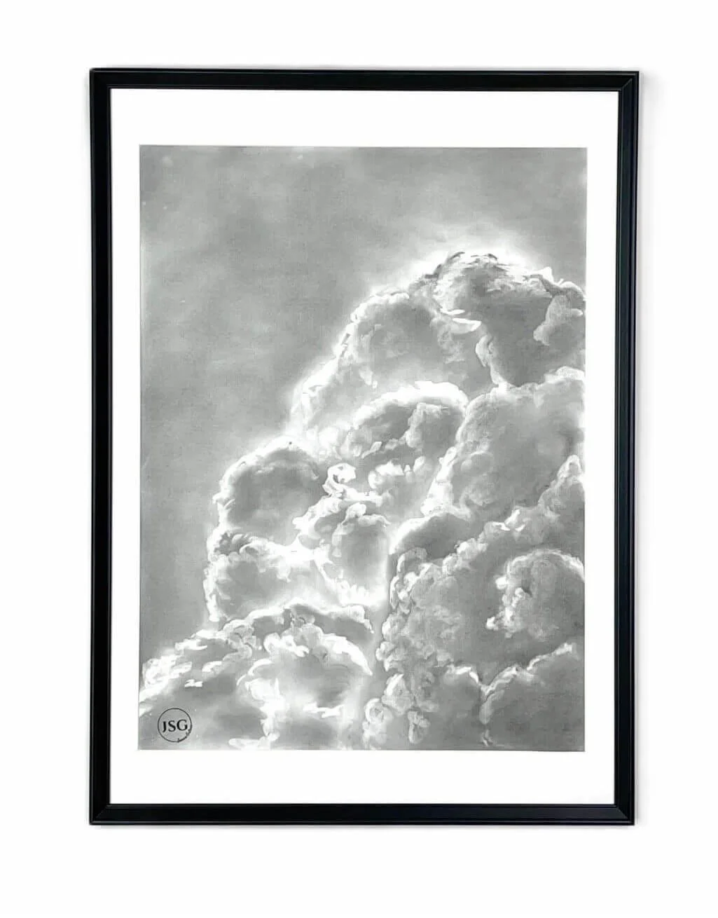 Black and white framed photograph of clouds in the sky with sunlight shining through, with a small initials JSG in the bottom left corner.