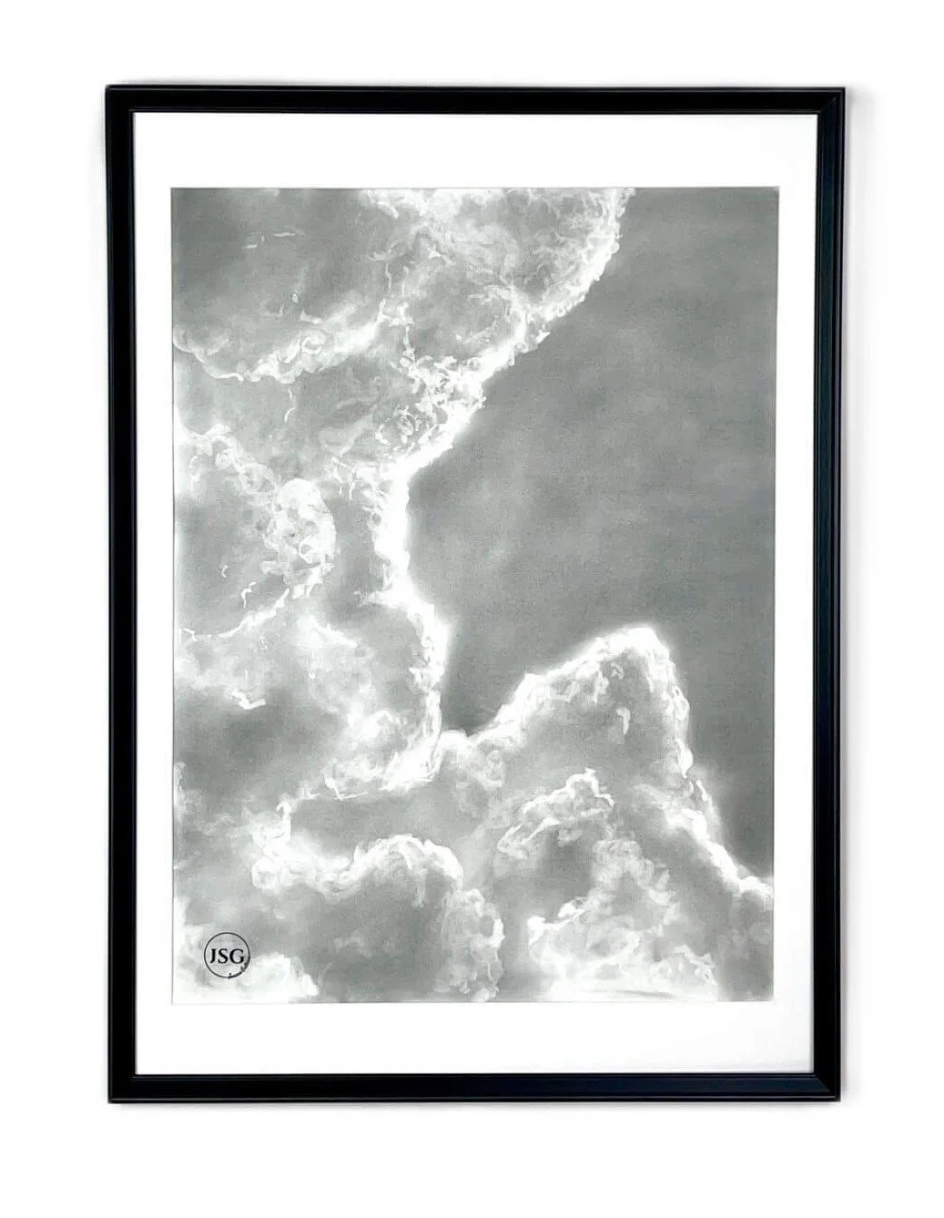 Black and white framed photograph of clouds in the sky.