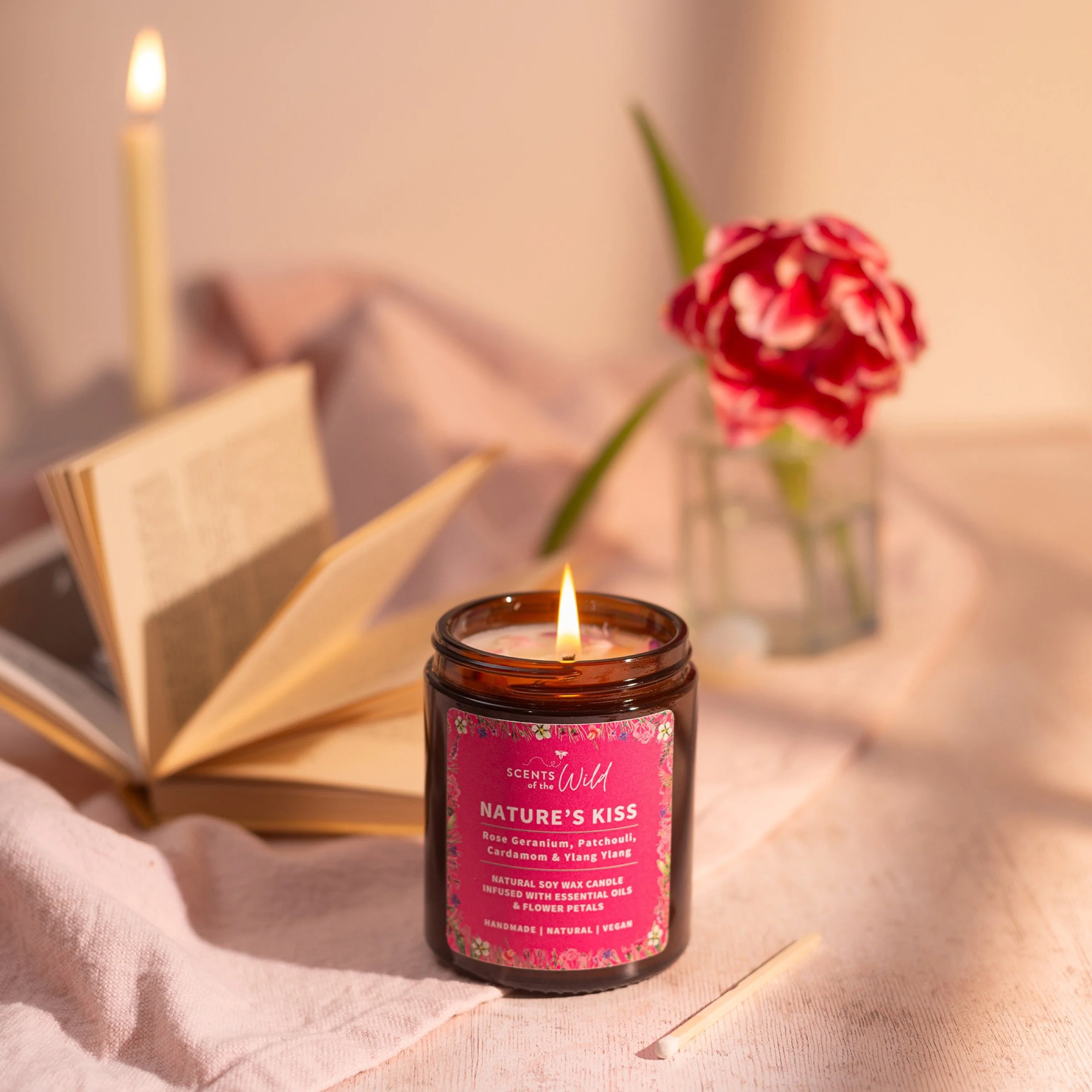 a romantic image of a 'nature's kiss' candle