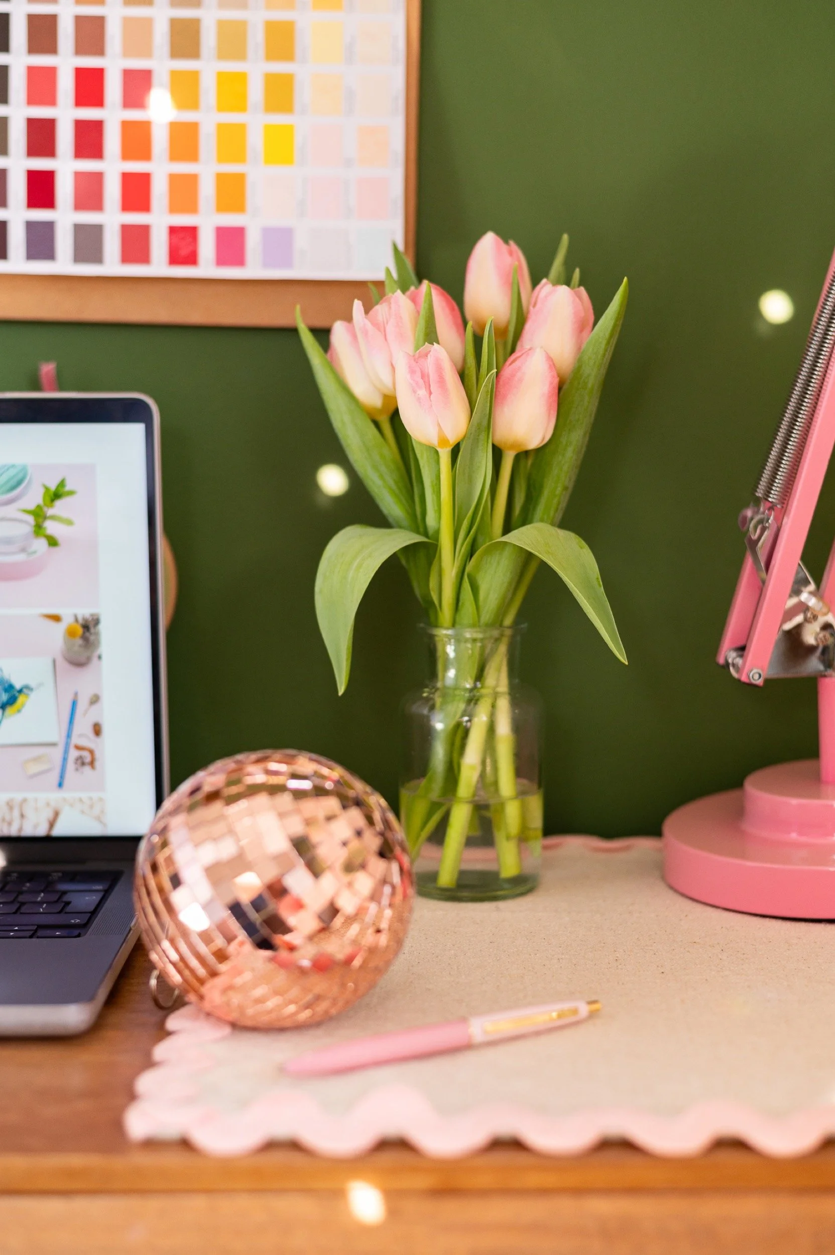 jillyjilly studio desk close up featuring tulips, colour chart and mirror ball