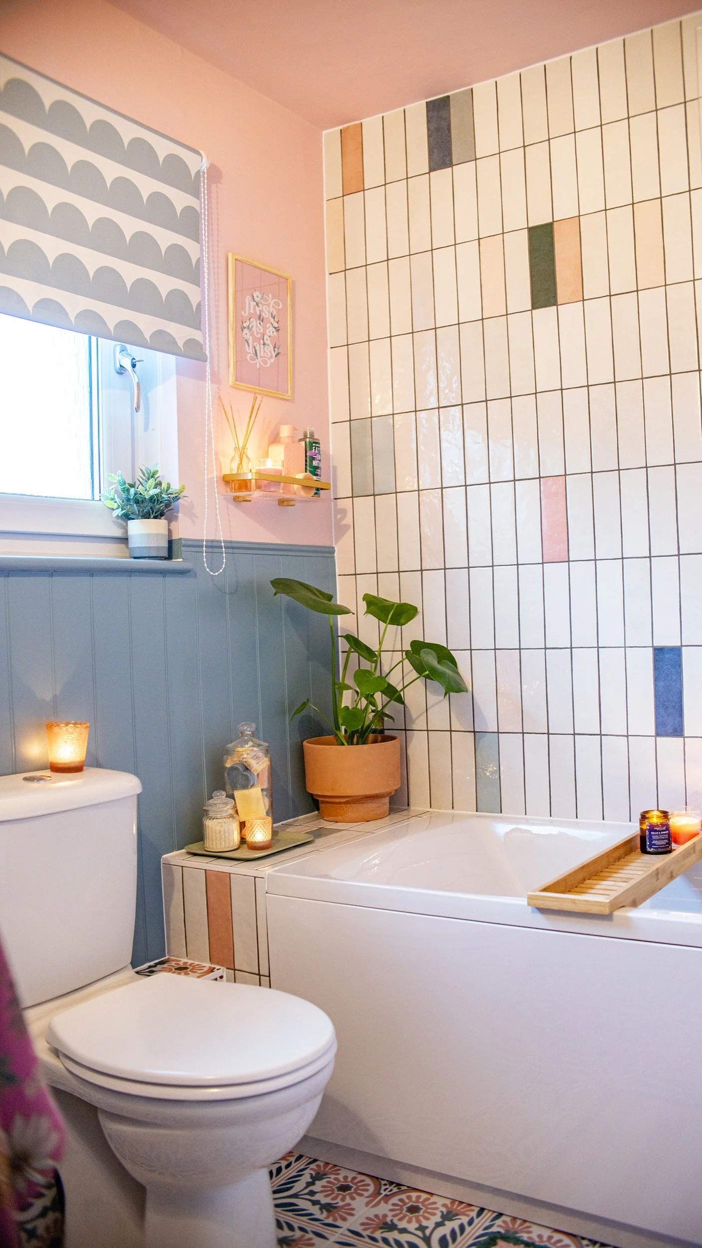 pink and blue bathroom with artful tile arrangement