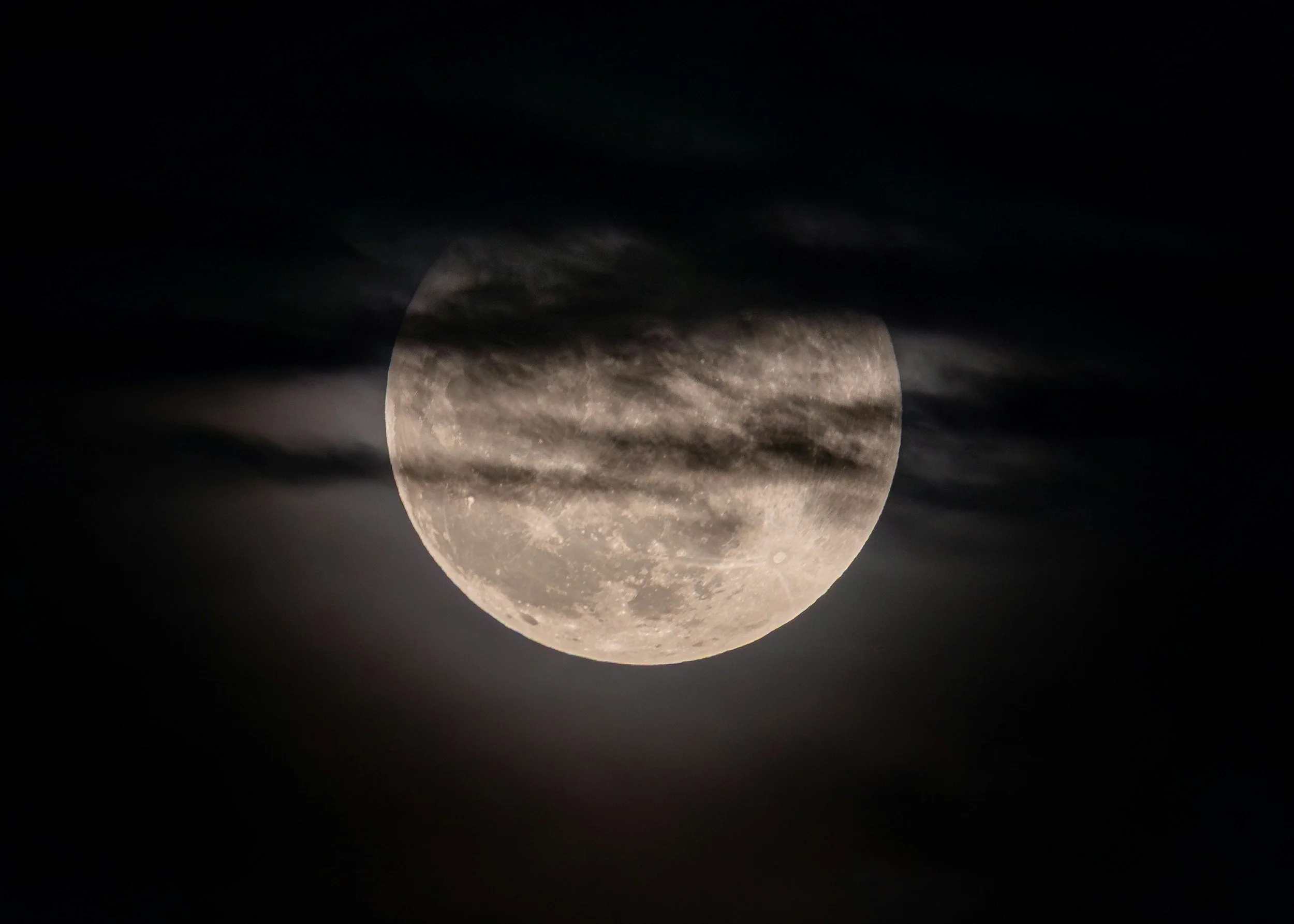 A full moon in a dark night sky, for the body’s sleep signals