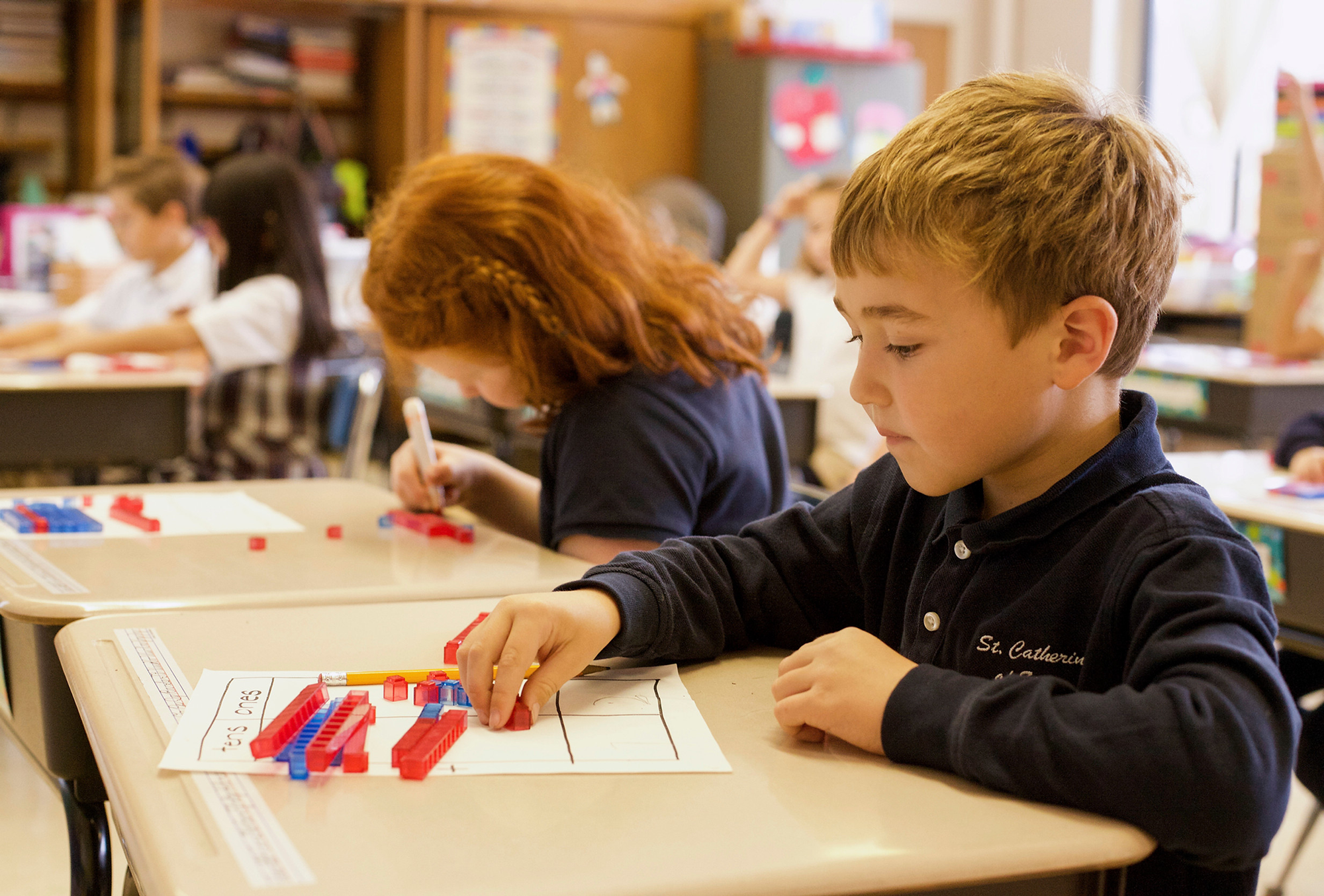 two-young-students-with-math-exercise.pn