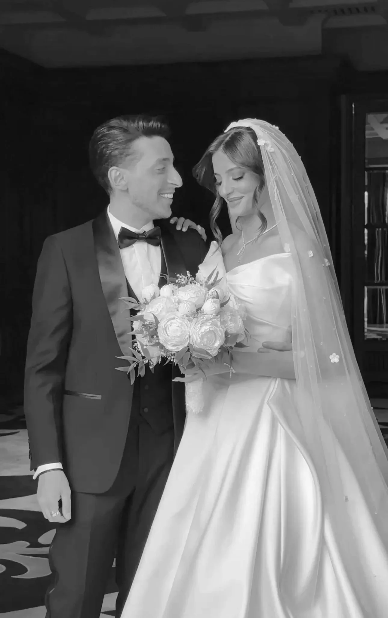 A black and white photo of a bride and groom at their wedding in dubai, wedding content creator dubai, wedding content UAE, wedding photography and videography, best wedding content creator dubai, wedding content creation expat